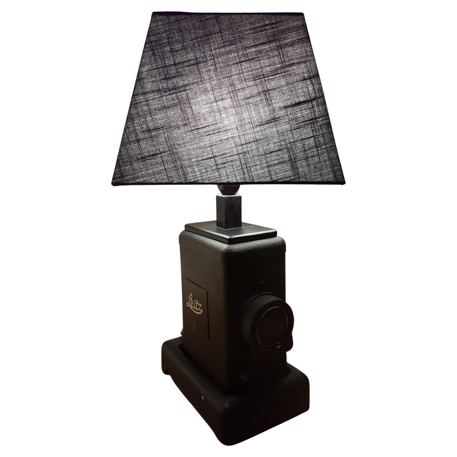 One of a kind , Very charming and creative Industrial Vintage Black Table Lamp created  using a historical 1933 Leitz original projector and adding a  black lamp shade. The projector is numbered.
Lamp base 16cm x 23 cm h 33cm 
black lamp shade h