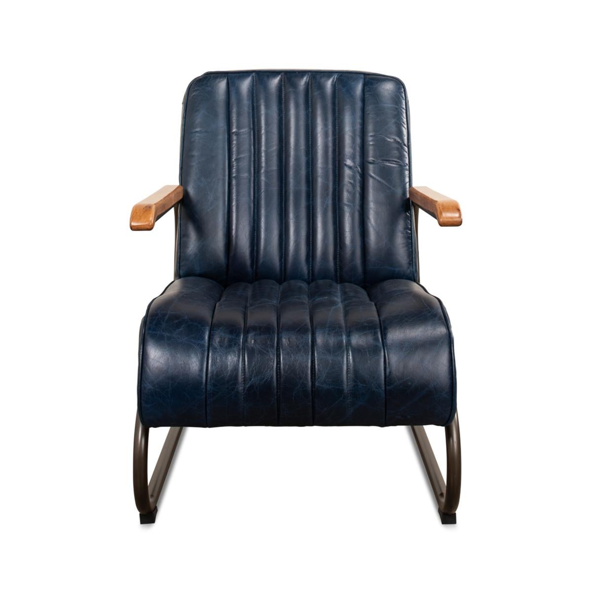 A modern leather armchair with top-grain Chateau Blue vintage leather with chaneled and boxed backrest and seat cushion, jute upholstery to rear and oak armrests supported by a metal industrial frame.

Dimensions: 24