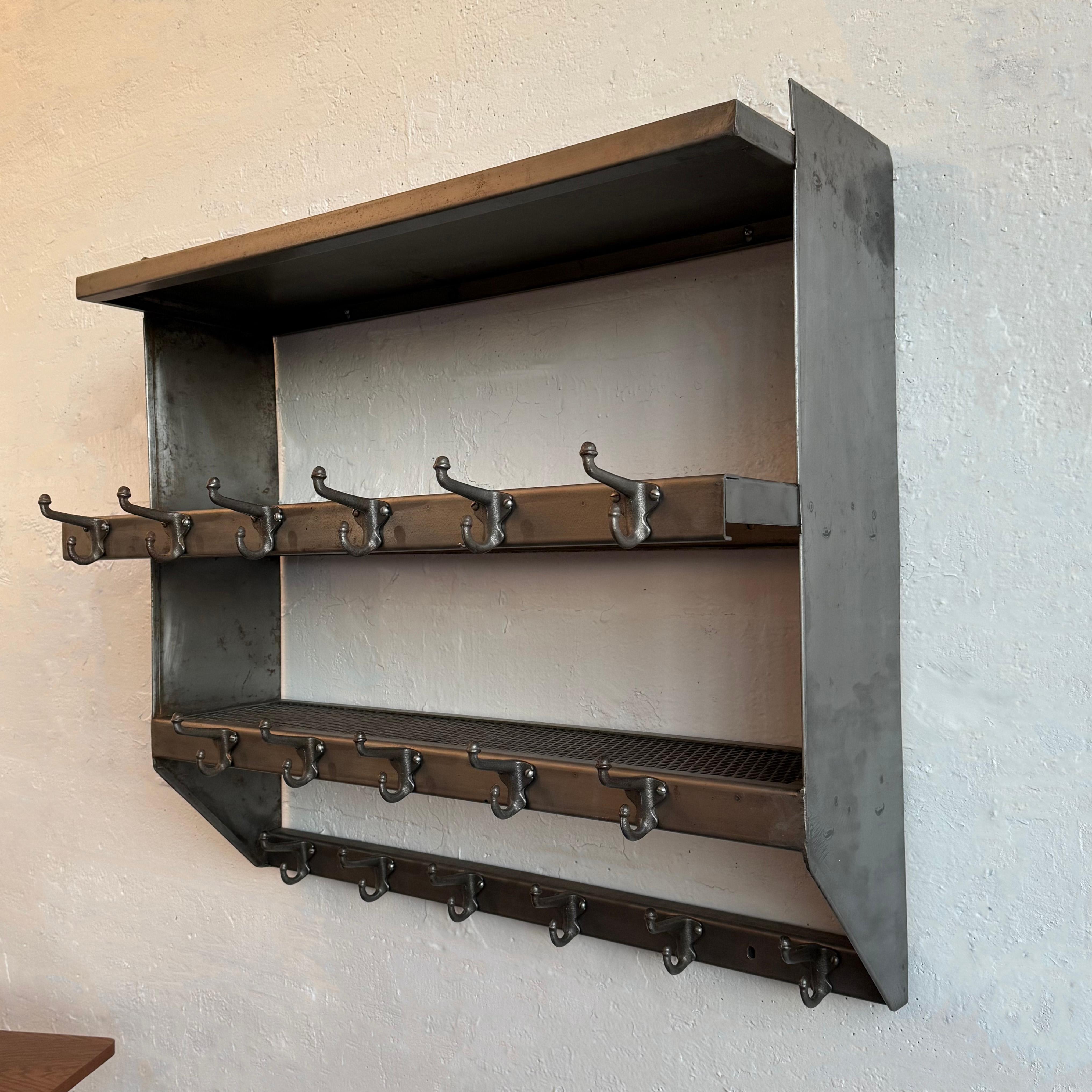 Organize your entryway hallway or mudroom with this industrial, brushed steel, wall-mount, school gymnasium, shelf unit coat rack. The unit features three graduated shelves; two of steel mesh and one solid steel on top lined with 17 premium quality