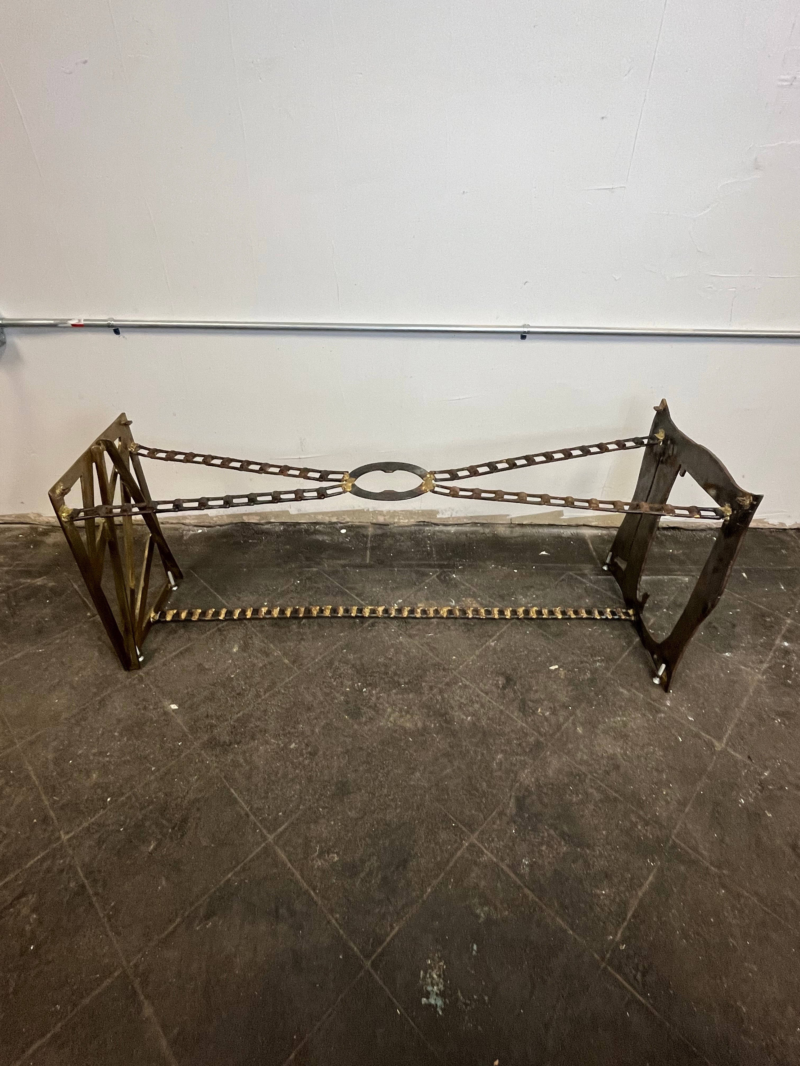 Unique torch cut coffee table with a quadrilateral glass top. Brutalist industrial design. Glass top tapers from 18.75