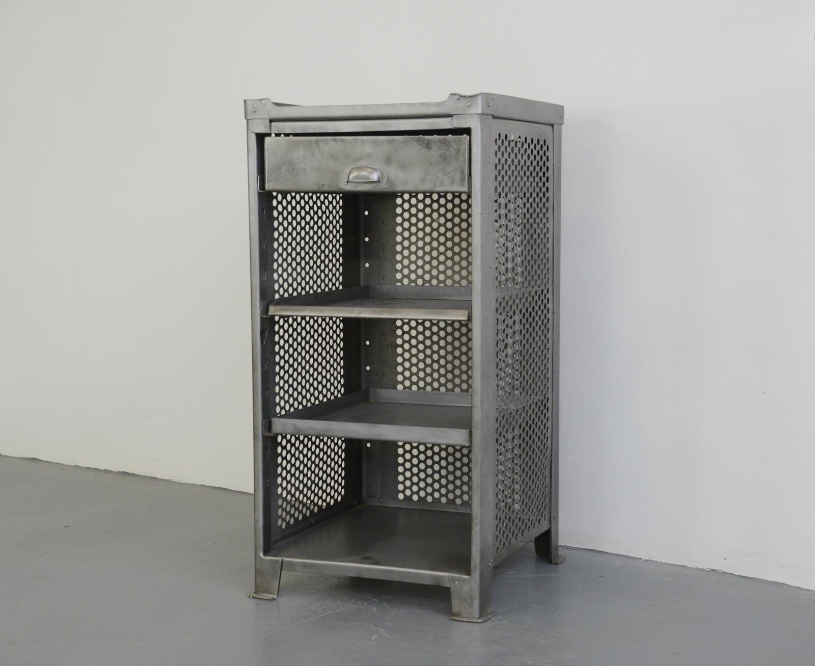 Industrial cabinet by Rowac, circa 1910

- 3 storage shelves and 1 drawer
- Original oak top
- Made from perforated sheet steel
- Designed by Robert Wagner
- Manufactured by Roawc, Chemnitz
- German ~ 1910
- 99cm tall x 50cm deep x 50cm