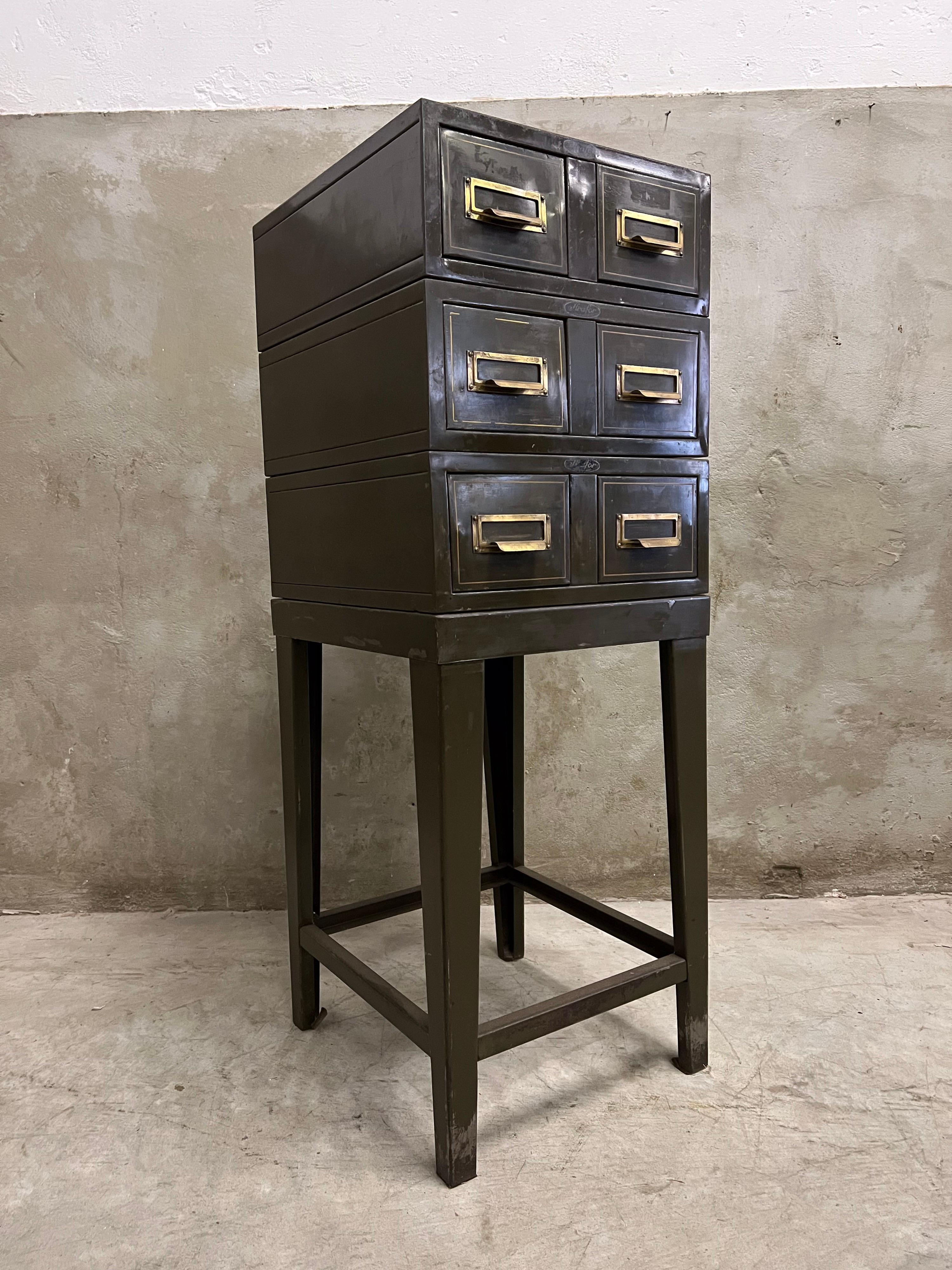 Rare filing cabinet which dates from the 1930s-1940s. All metal with brass fittings. Designed and produced by Strafor Forges Strasbourgh in France. Marks still clearly visible. Consists of 5 parts, 3 parts with 2 drawers and the base. Beautiful