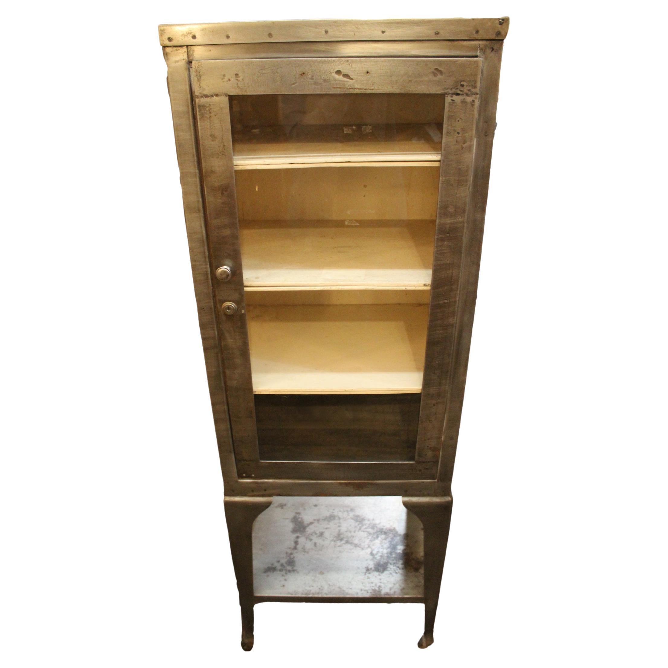 This tall display cabinet has been taken down to bare metal and then sealed to give a handsome industrial factory look. The unit comes from a doctors office and is at least 100 years old.
Please confirm location NY or NJ