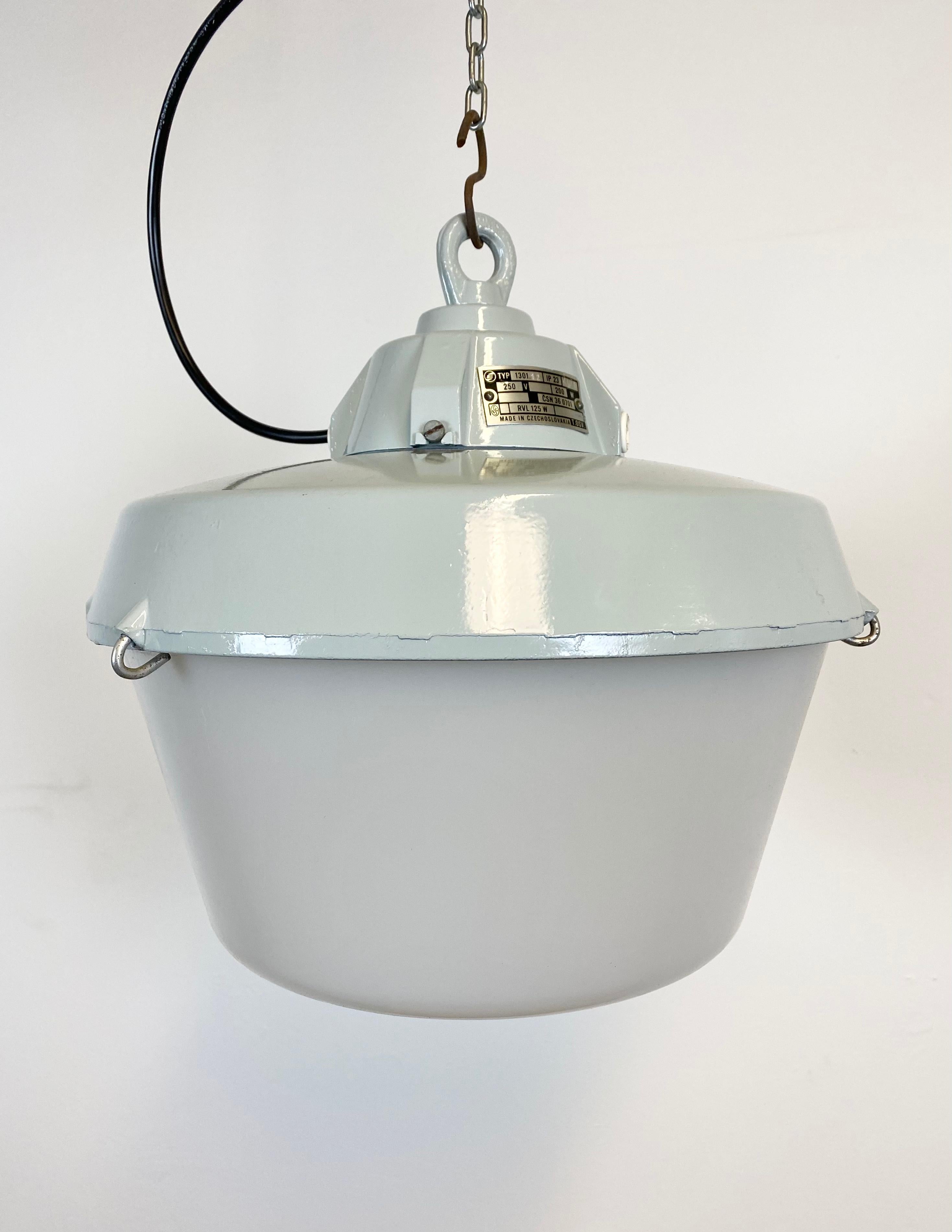 - Pendant lamp originally used in factories in former Czechoslovakia. 
- Made by Elektrosvit during the 1970s.
- Cast aluminium top.
- Milk plastic cover.
- New porcelain socket for E 27 lightbulbs and wire. 
- Weight: 3 kg.