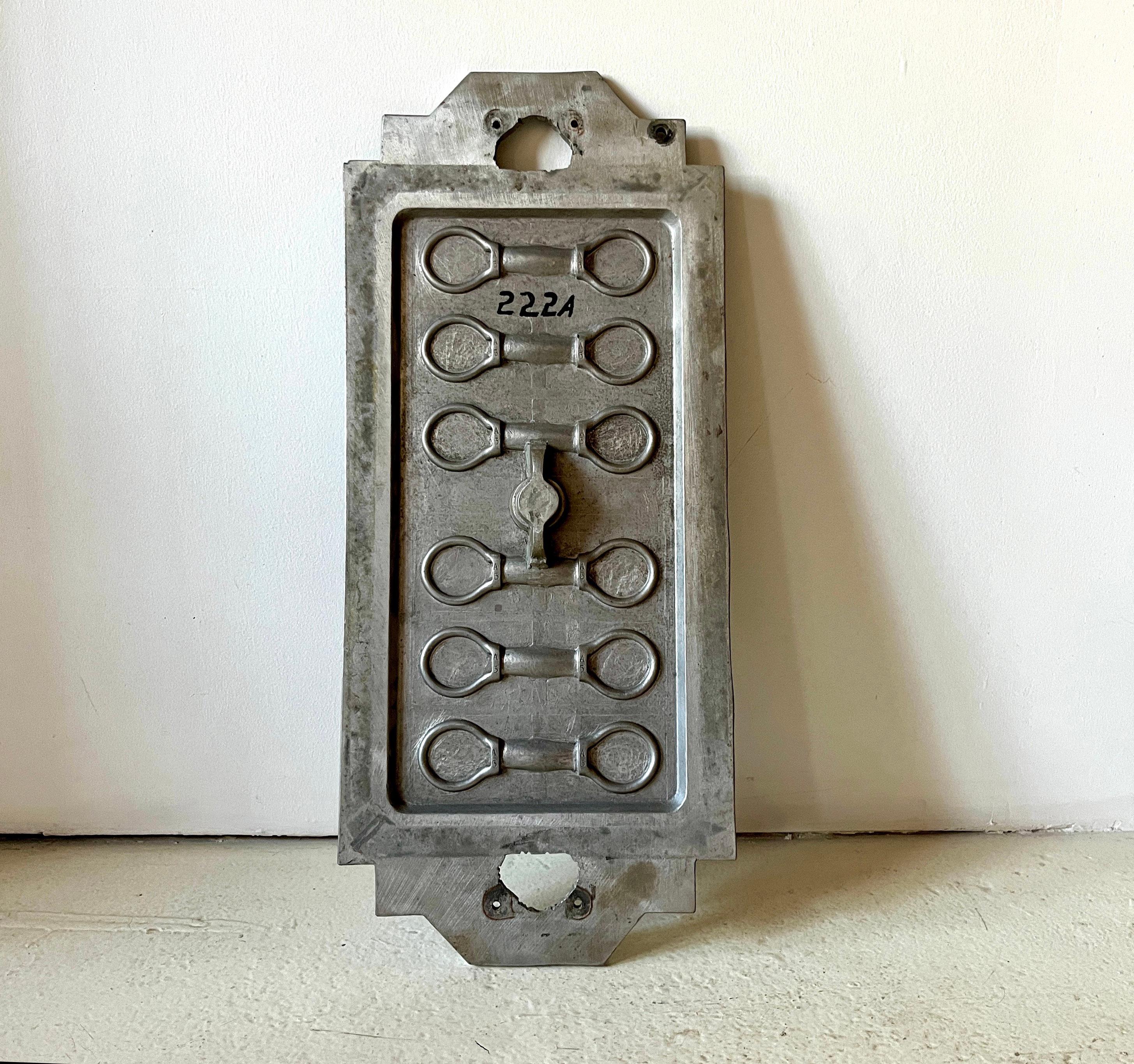 This classic American Industrial cast metal foundry pattern mold makes a great conversation piece. Large size with intricate pattern for perhaps some kind of horse saddle part? Great patina. Engraved/stamped with 