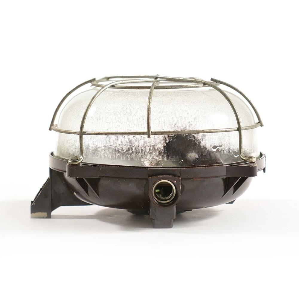 Czech Industrial Ceiling/Wall Light in Bakelite and Glass with Metal Cage, circa 1950 For Sale