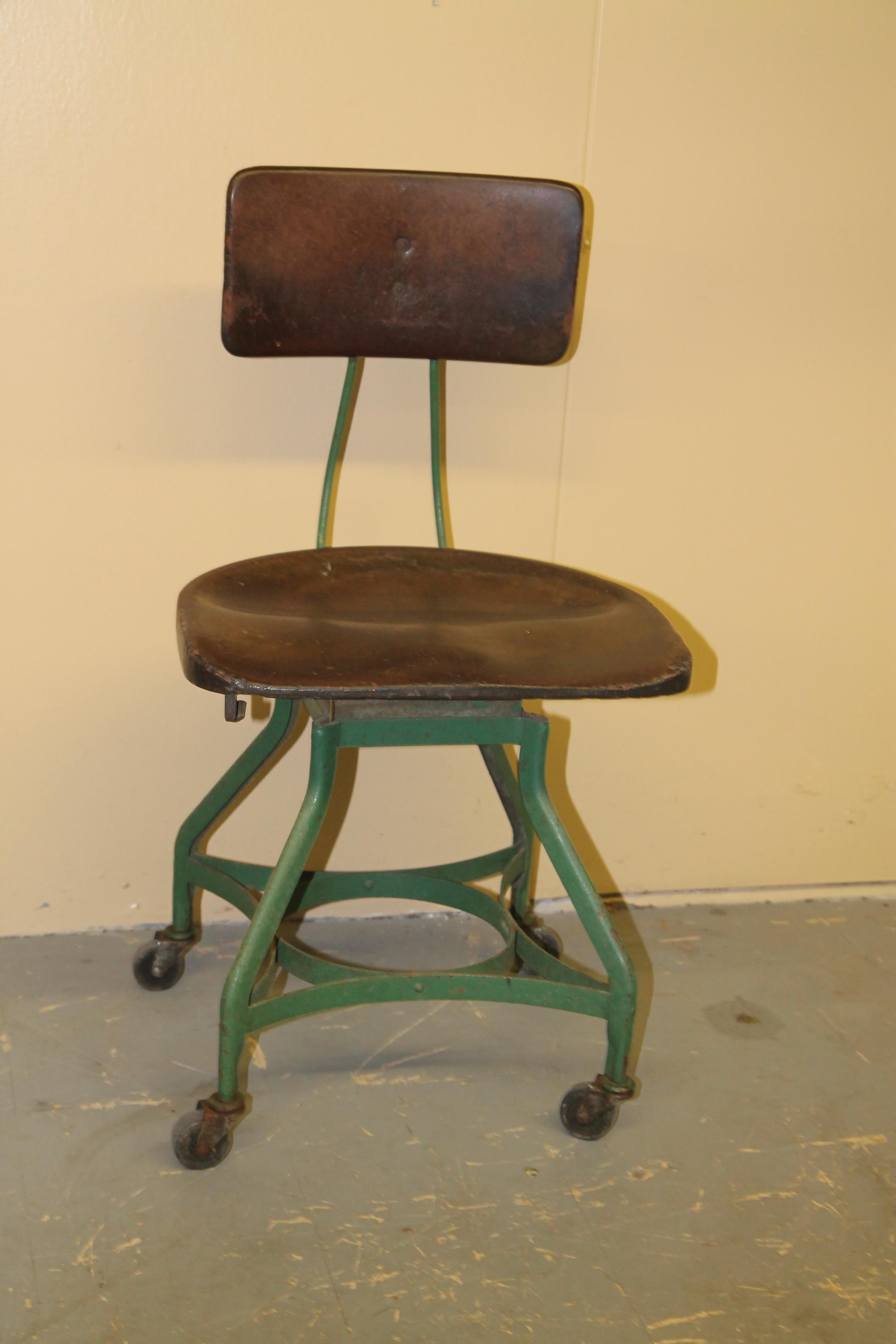 Unusual chair by the Toledo metal furniture Co. Chair has a seat and back made from a composite material that at first glance looks like leather. Have owned many Toledo stools and chairs but have never seen this example.