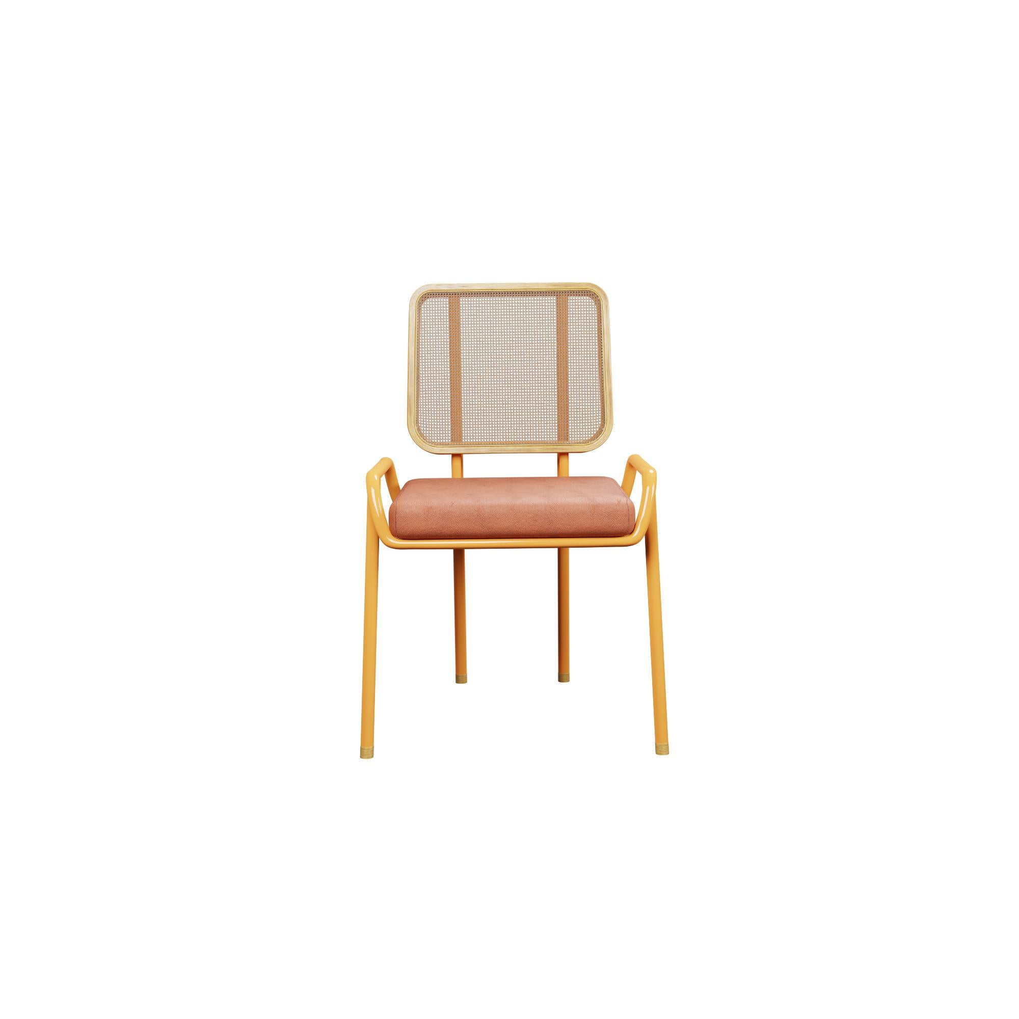 Murmurio's half arm DUV sturdy iron structure provides a solid foundation, while the intricately woven rattan backrest, supported by an ashwood frame, adds a touch of natural beauty. The seat is upholstered in genuine leather, offering both comfort