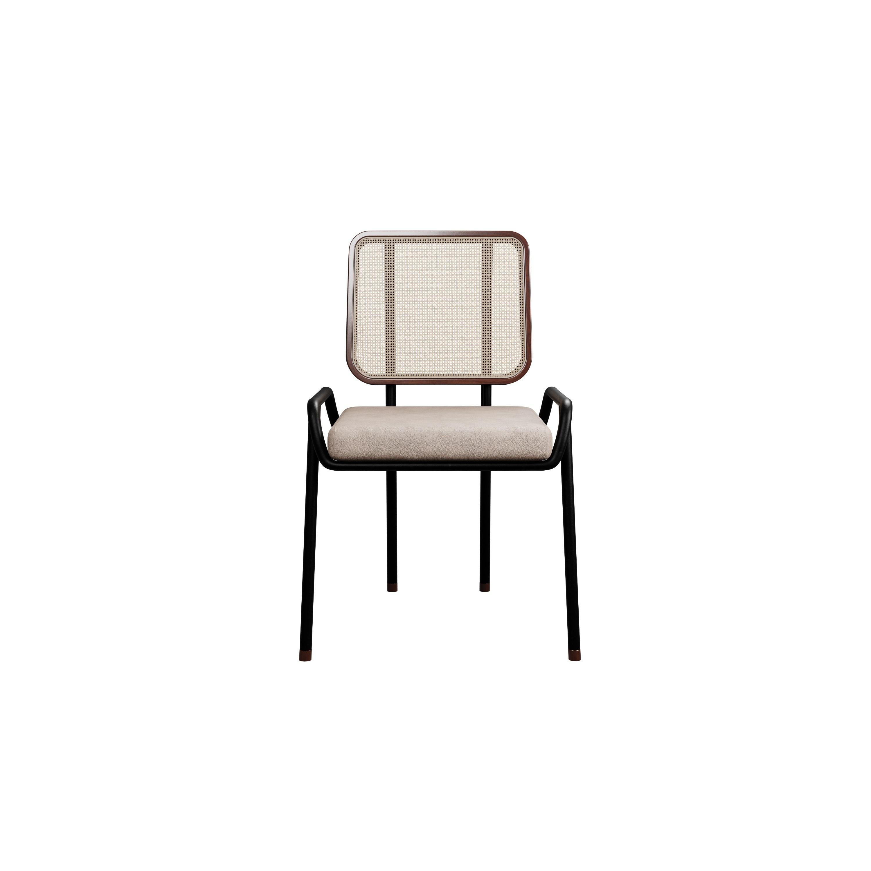 Murmurio's half arm DUV sturdy iron structure provides a solid foundation, while the intricately woven rattan backrest, supported by an ashwood frame, adds a touch of natural beauty. The seat is upholstered in genuine leather, offering both comfort