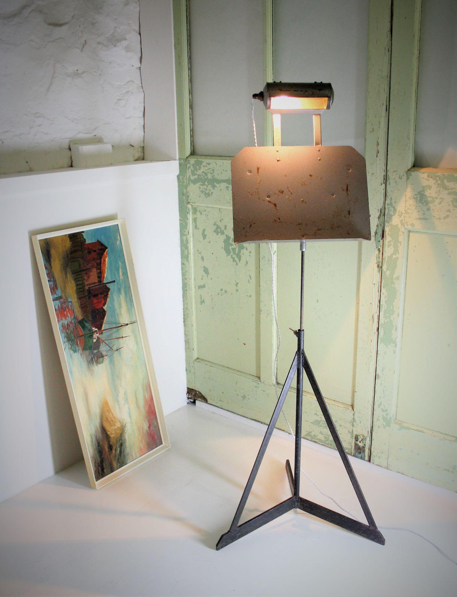 A heavy steel conductor music stand with light. Believed to be from a coal mine where conductors stands were used for choir practice. A nice decorative piece with good industrial form. an be used as a painting or book stand.
Circa 1950s
Stand is