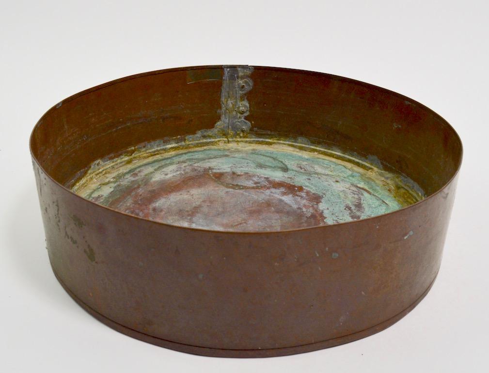 Industrial copper bowl repurposed as planter, decorative architectural element with some Verdigris finish in the interior.
Probably originally part of a machine, this can be used as a large center bowl, planter or sculptural decorative objet d' art.