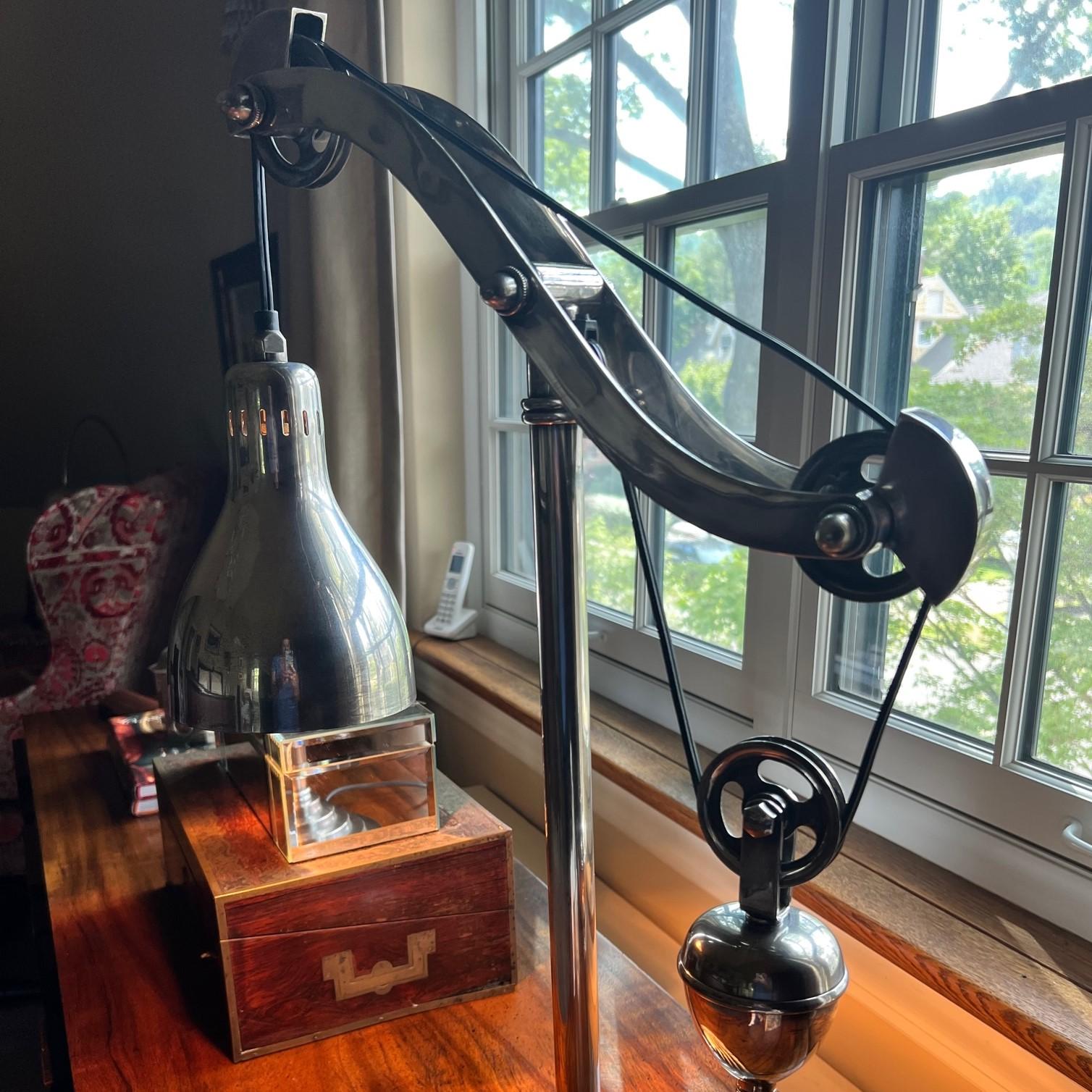 Late 20th c. industrial counterweight pulley desk/table lamp in solid brass (lamp weighs 14.8lbs) with an antiqued silver finish. Over time the finish will acquire a patina and will age to a pewter color. If a patina is not desired, the lamp can be