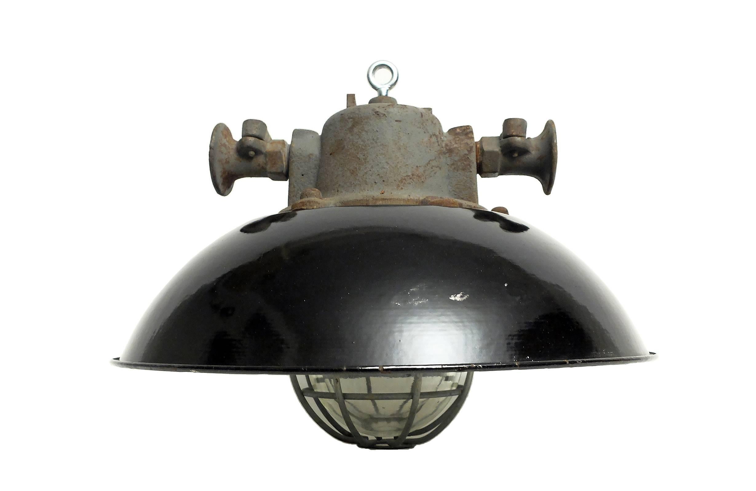 Ceiling lamps with cast iron top, dome-shaped shade, and caged thick glass.
Made in Czechoslovakia, circa 1940. Excellent original shape and patina. Six available, priced per light.
 