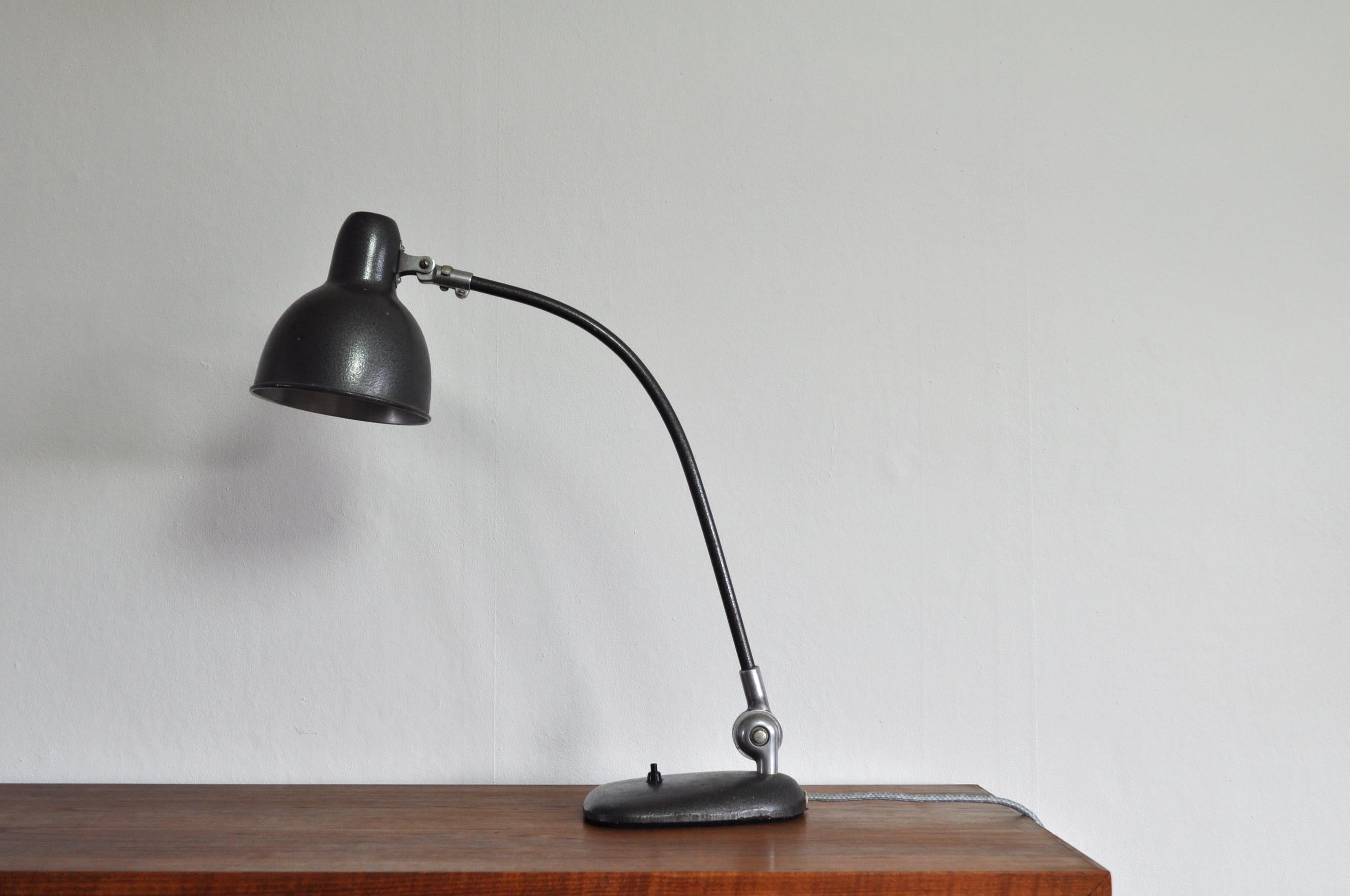 Fully adjustable Bauhaus style desk lamp in metallic dark grey color. Raw industrial look with patination, weight 3.6 kg/ 7.14 lbs. Manufactured in Denmark by ASAS.