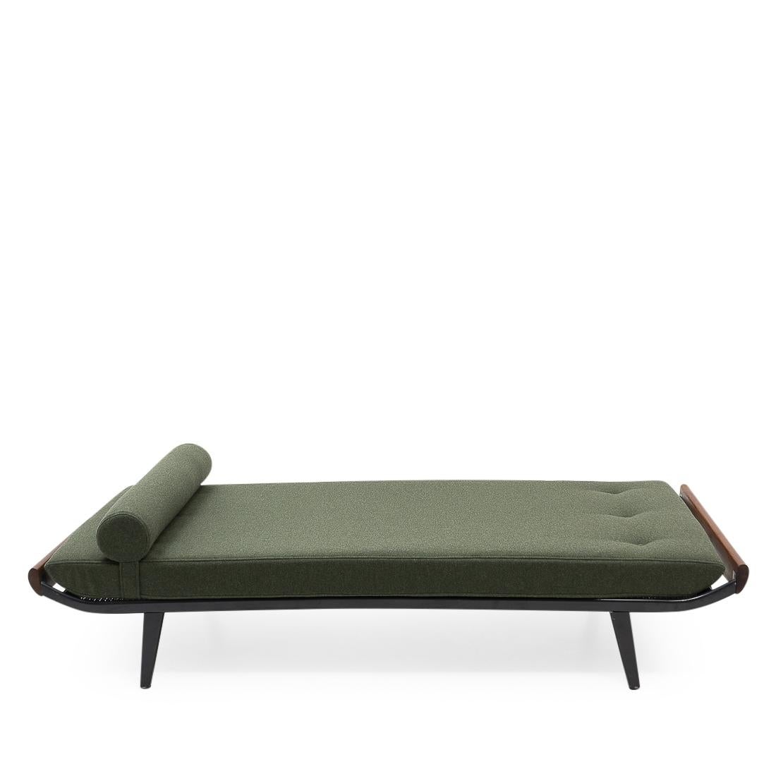 Vintage daybed designed by Dick Cordemijer for Auping (the Netherlands) during the 1950s.
New high-quality green woolen upholstery and foam; the daybed can be used as both a sofa and spare bed. The cover features a zipper on both pillow and