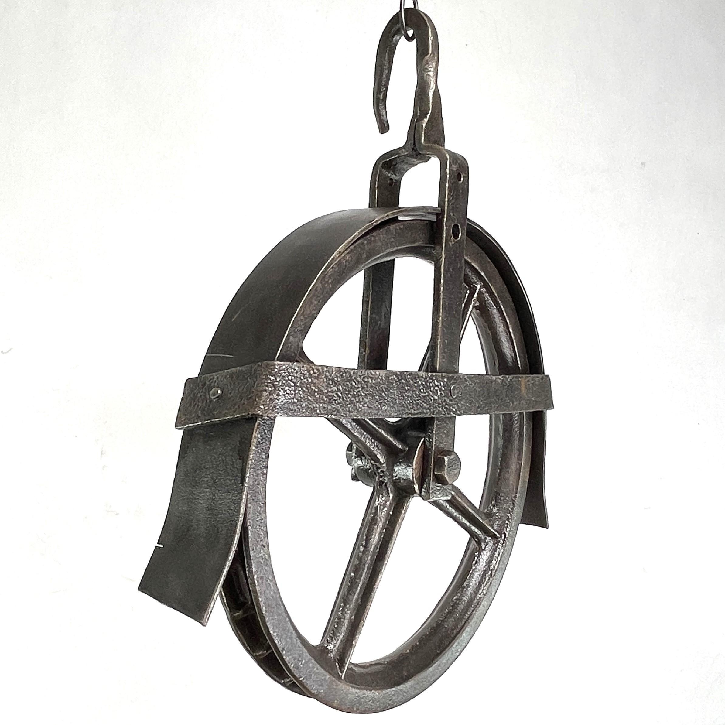Old large Pulley Industrial Design - 1950/60s

The old pulley (cable pull) in industrial design is an impressive piece of the past times. It combines the charm and sturdiness of the past industrial era. 

This iron pulley was once used by farmers