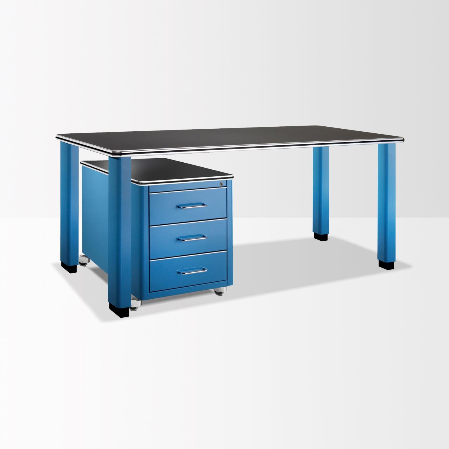 Executive metal desk in classical industrial design style. The timeless essential form of the desk with rolling cart / trolley, creates a clear and distinctive workplace adapted for different interior situations. The desktop can be covered on choice