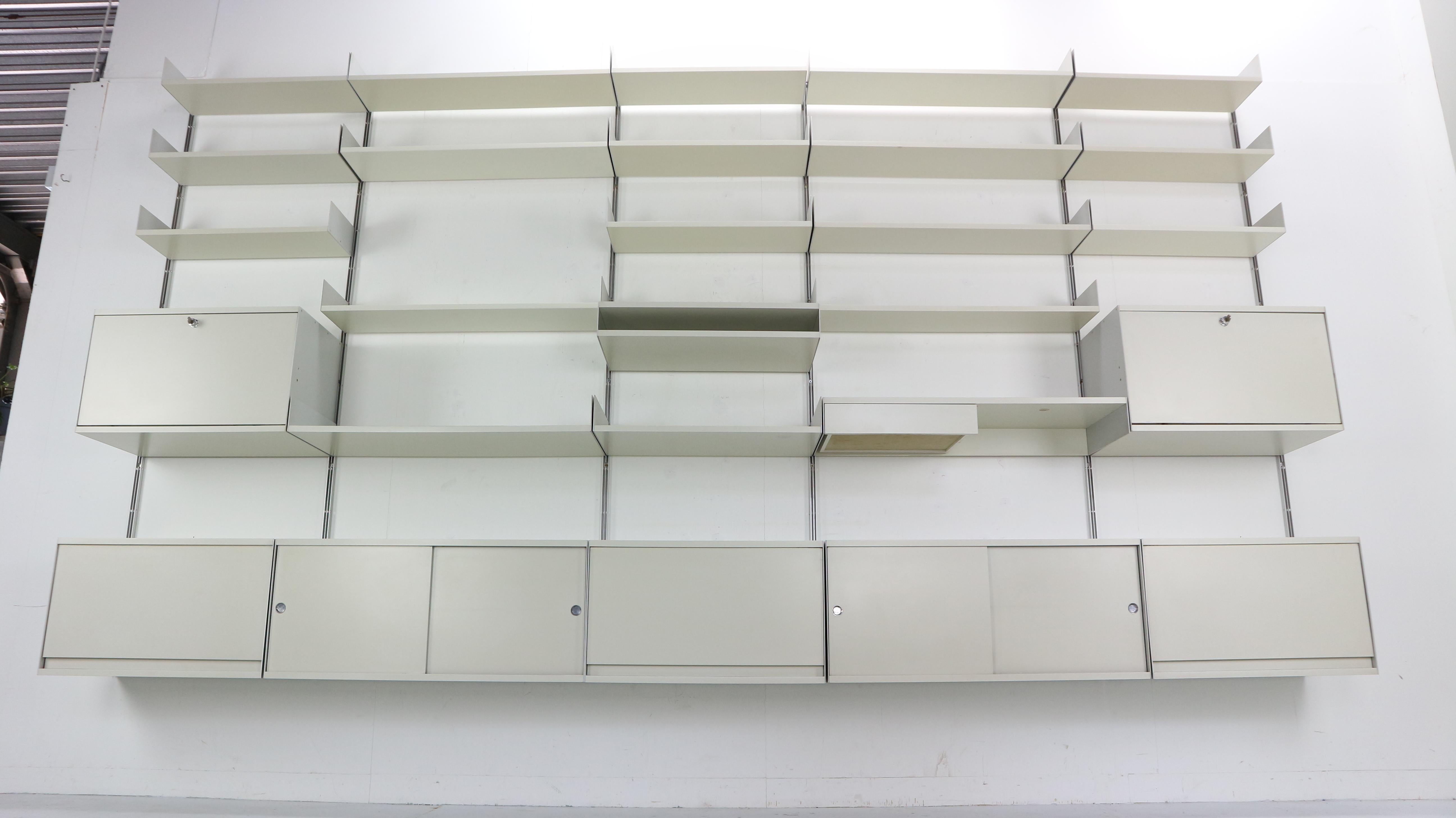 Industrial design large wall system made by Vitsoe in Germany. Design by Dieter Rams in 1960.
Model number: 606.
Universal shelving system made from aluminum and comprises with 2 lock cabinets and keys, 5 cabinets and 20 shelves.
  