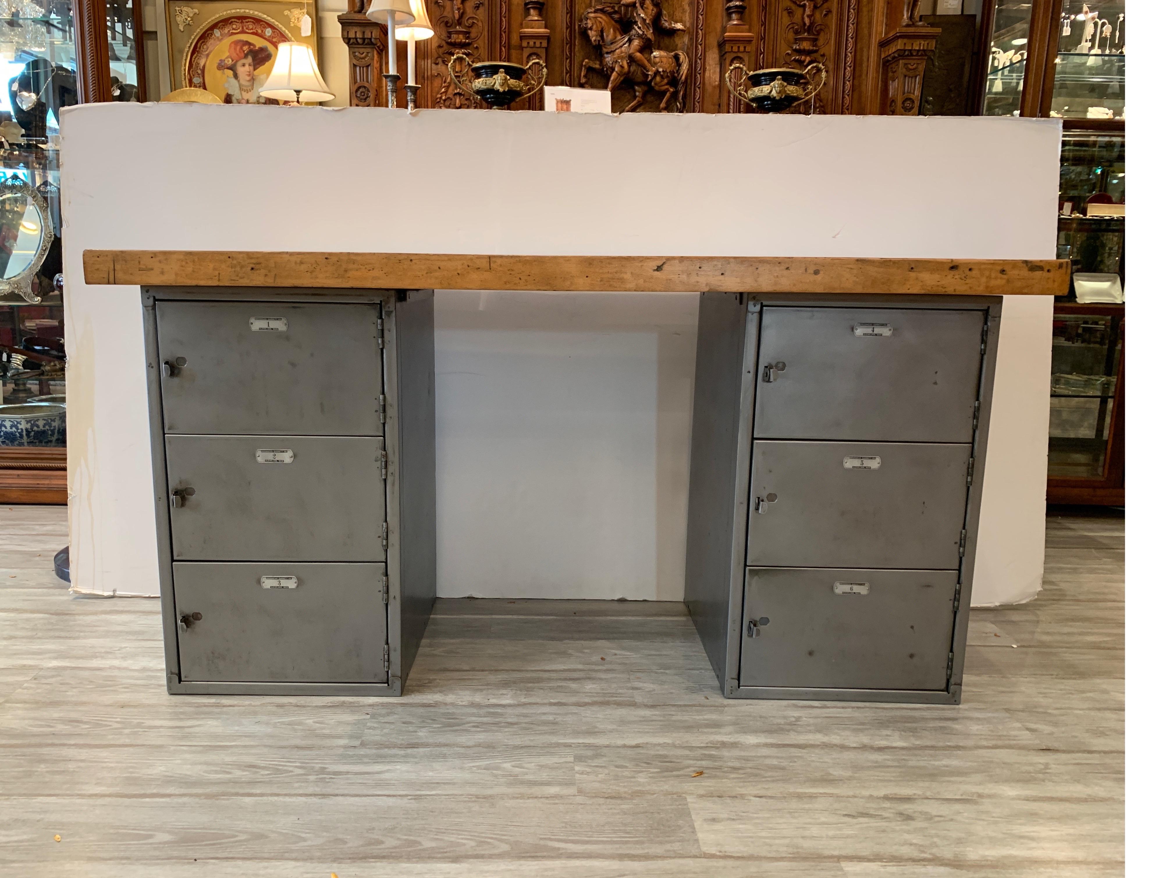 The vintage steel cabinets at the base, numbered 1 and 6 with spring loaded front door. The vintage maple butcher block top has been refinished lightly while still keeping enough of the original character and use to compliment the aged vintage steel