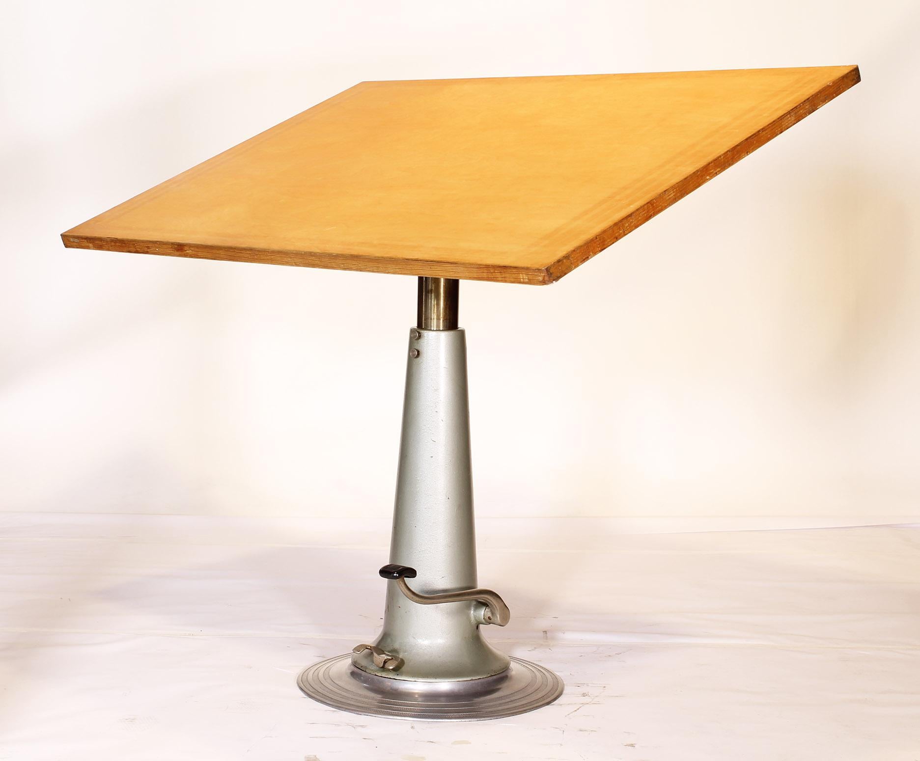 Authentic vintage industrial style swivel, tilt and height adjustable drafting table or desk by Nike. Made in Sweden, 1940-1950s, this is the tall version that will adjust from 38 3/4