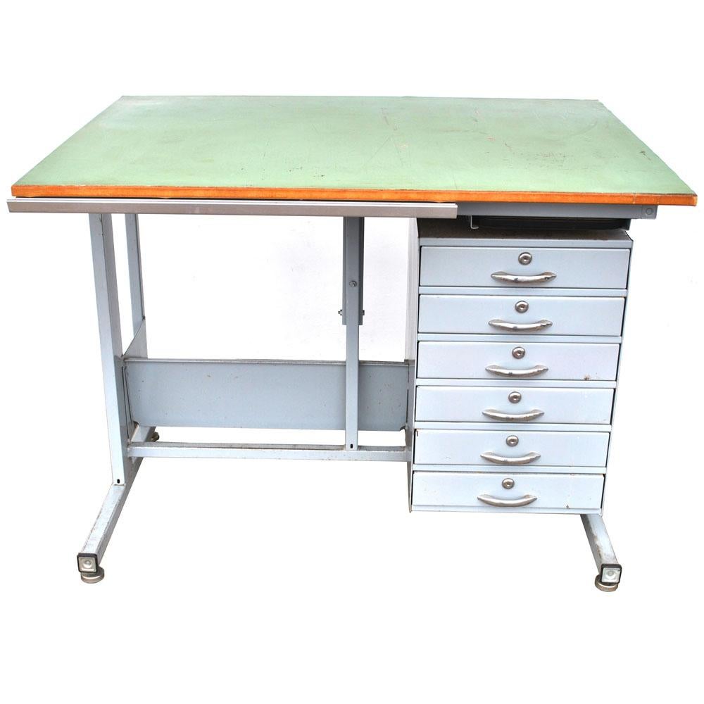 Garrett industries

Industrial drafting table desk 

A unique multi functional configuration in steel with wood top. Adjustable for drafting or use as a traditional desktop. Ample storage with 6 drawers and pullout / pull-out tablet.
      