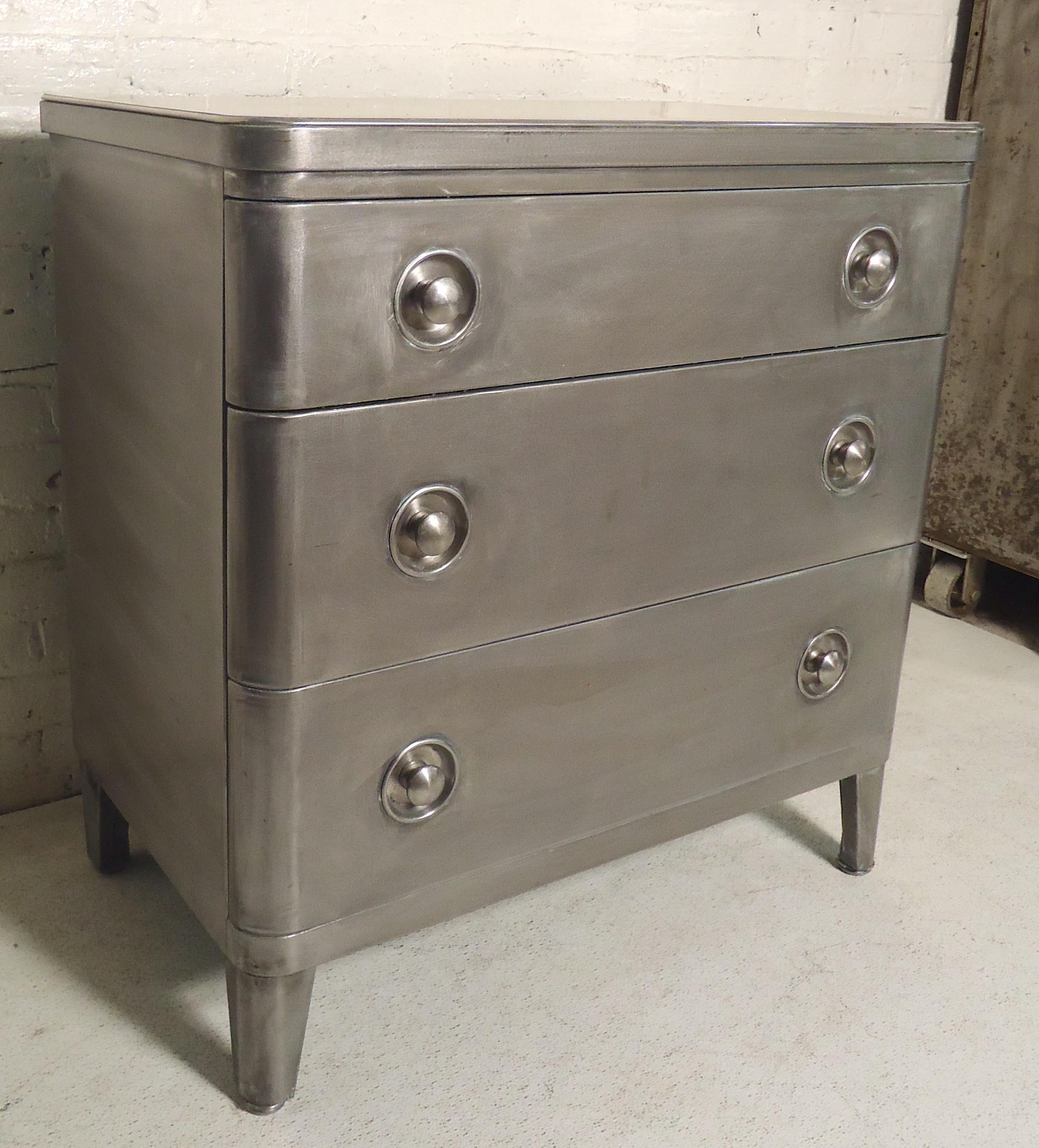 Mid-Century Modern dresser restored in a bare metal finish. Laminate top, rounded edges and three large drawers.
(Please confirm item location - NY or NJ - with dealer).
 