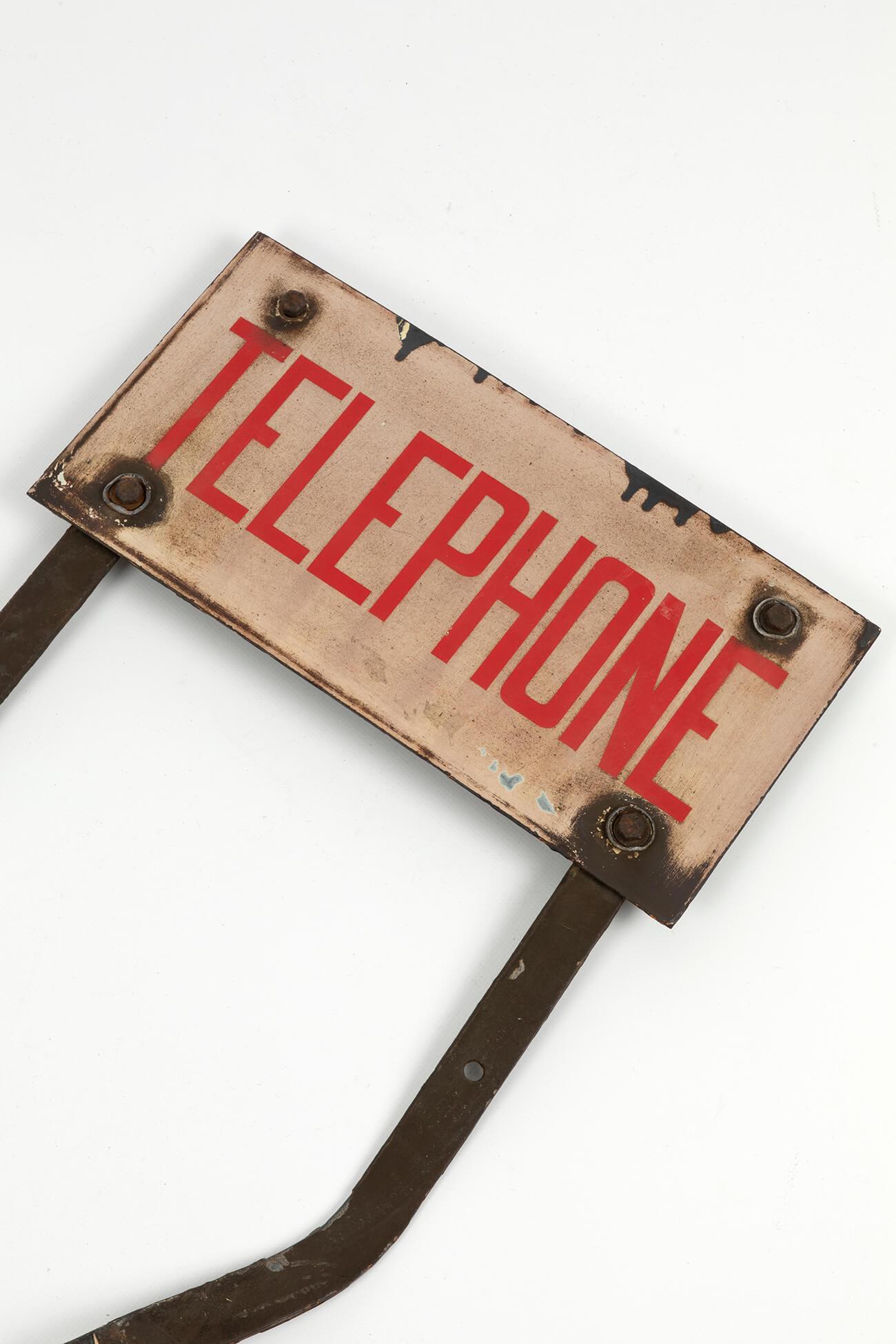 Original industrial enamel telephone sign in wonderful condition. Sitting atop its two original legs. Most likely used in a factory or possibly a mine. 
British, circa 1950s.

Additional information:
H 54 cm (H 21.2 inches)
W 41 cm (W 16.1