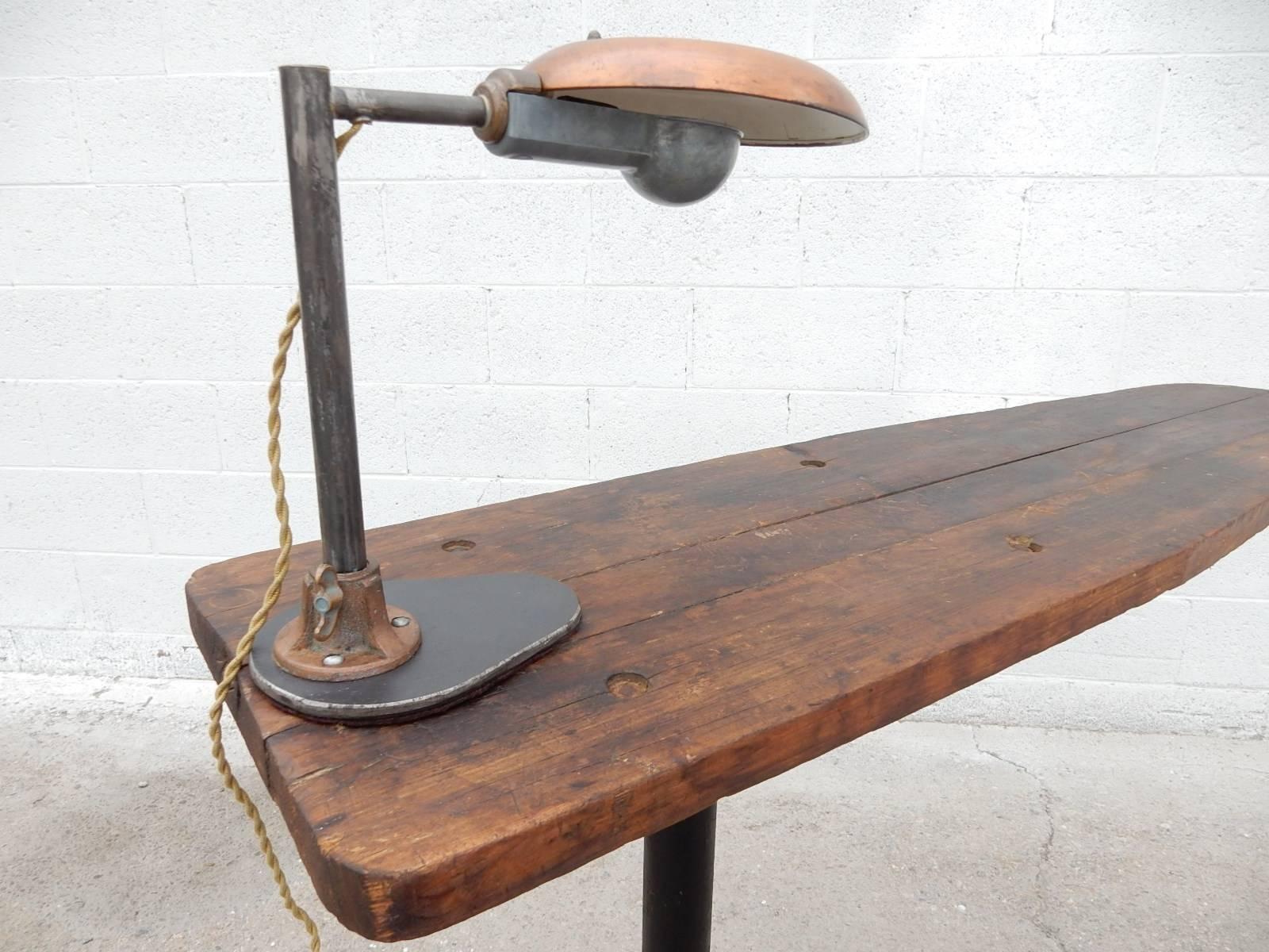 Industrial Era Cantilevered Work Table with Avant Garde Inspection Lamp In Distressed Condition In Las Vegas, NV