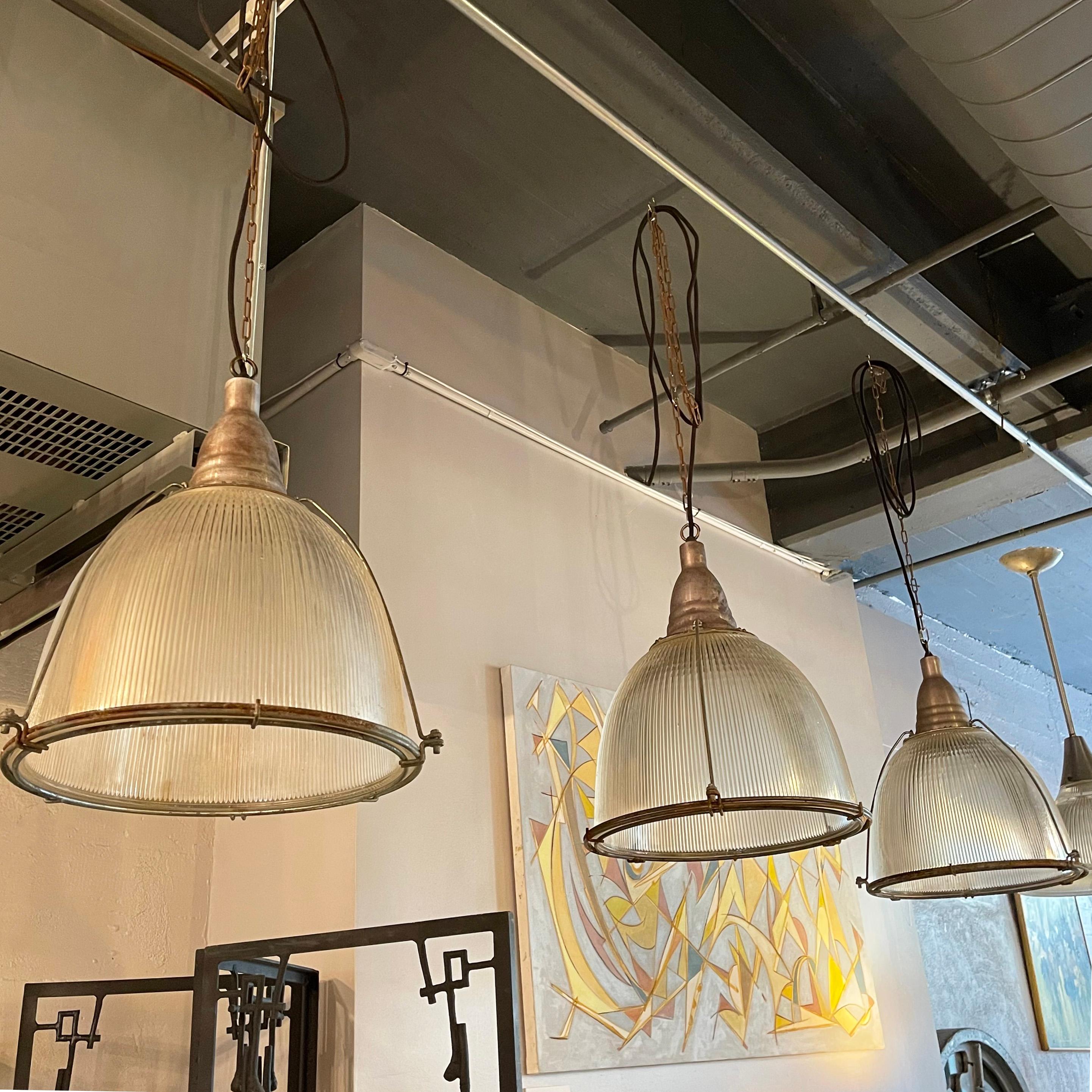 Industrial Factory Caged Holophane Glass Pendant Lights In Good Condition For Sale In Brooklyn, NY