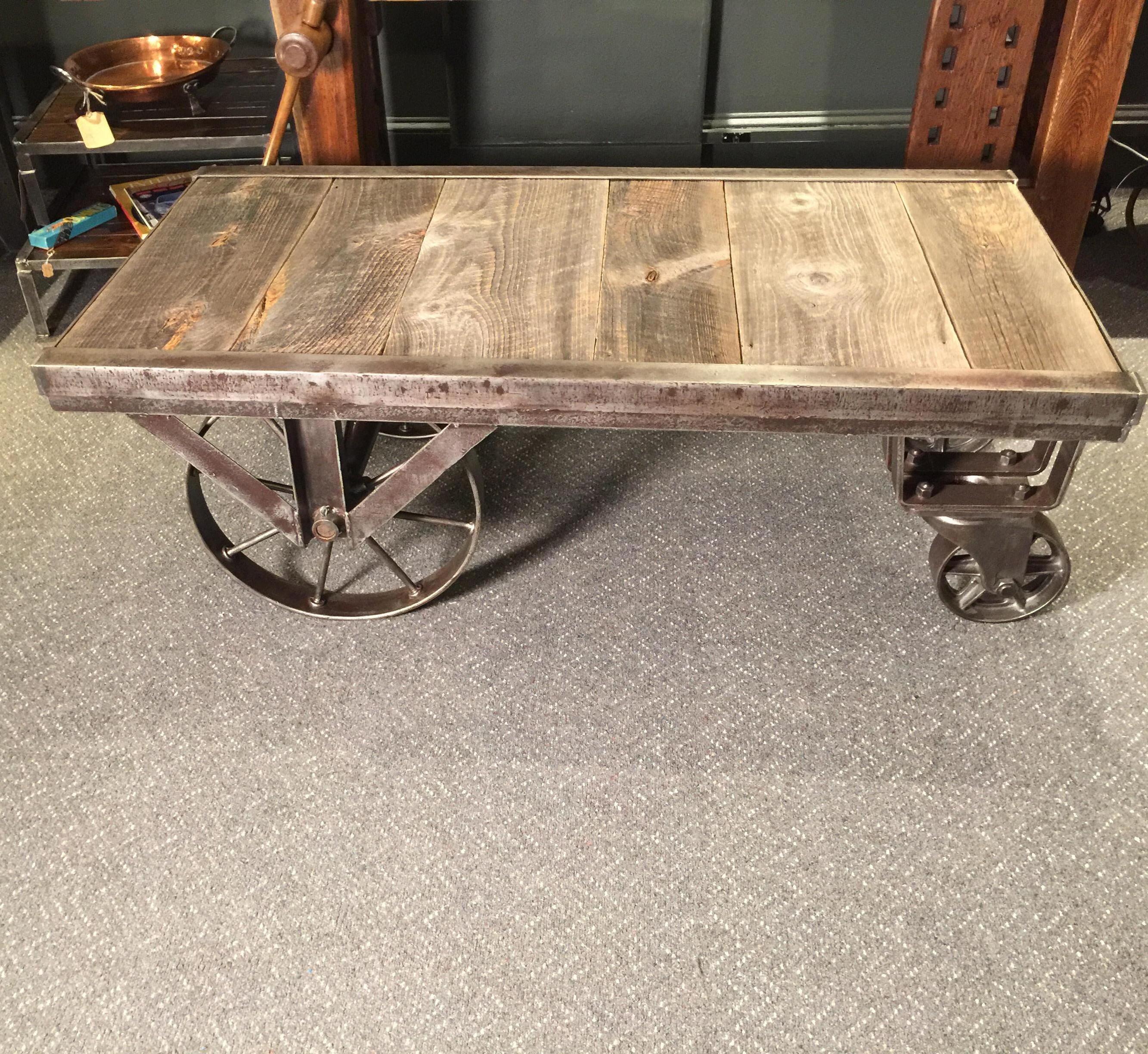 A steel and oak 1930s factory cart that has been fully restored. The steel has been cleaned and polished while still leaving age and patination. The oak had been detailed and much of the original character of the wood preserved. Amazing original