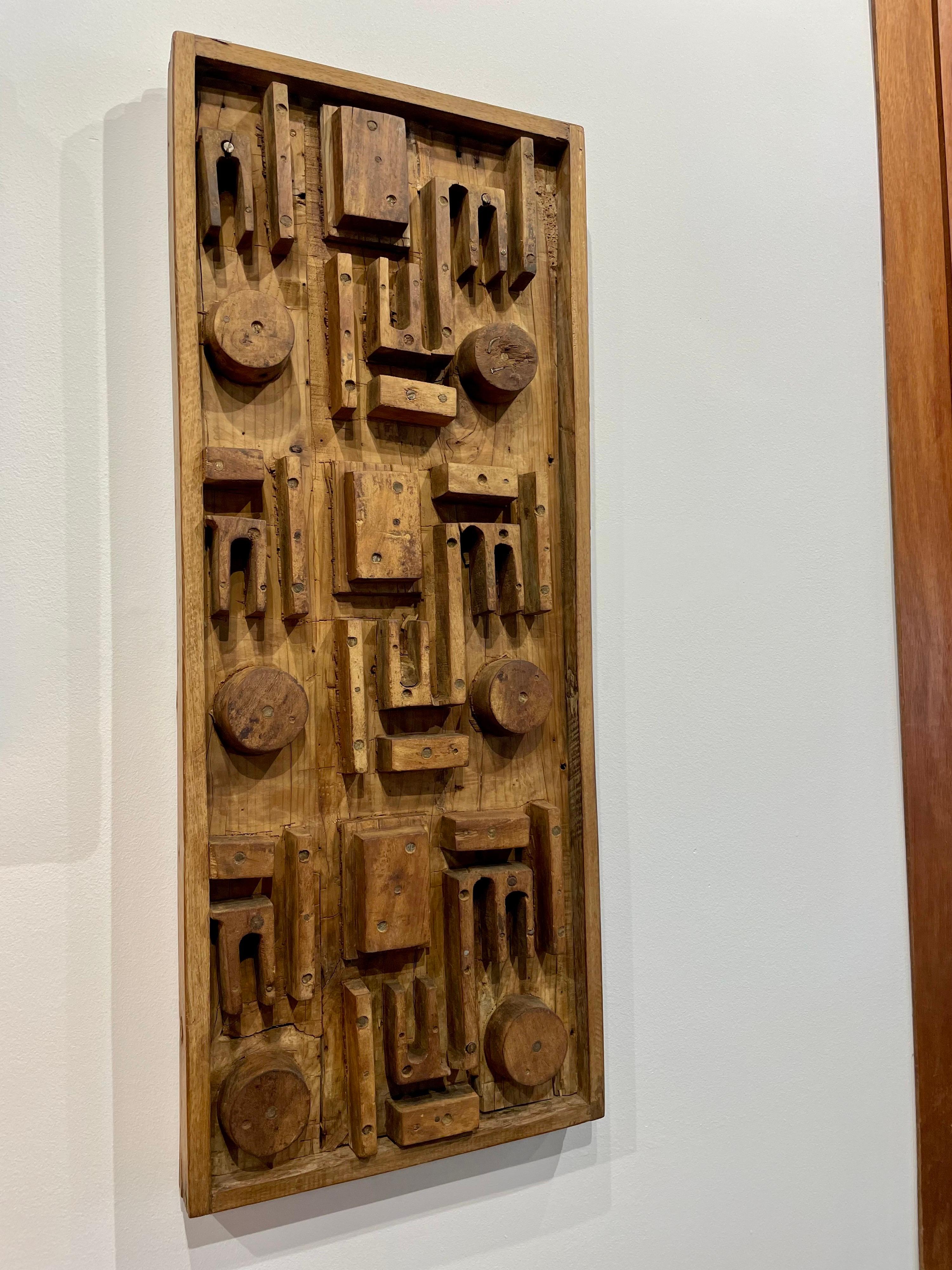 This is a wonderful industrial and geometric style factory mold in wood very much reminiscent of Nevelson. Can be hung vertically or horizontally.
