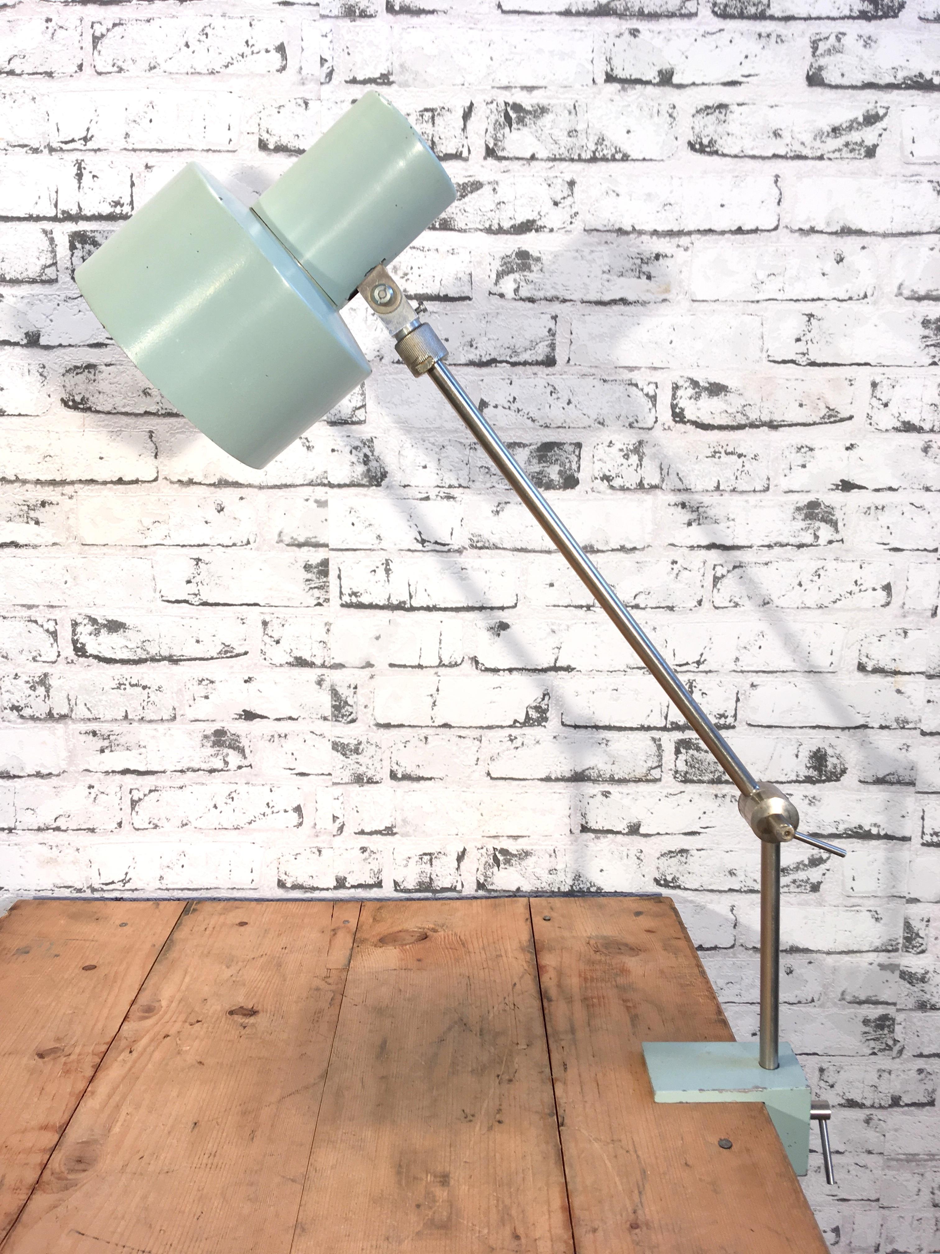 Grey factory office lamp from former Czechoslovakia. Lamp has two adjustable joints and clamp base.Socket for E 27 lightbulbs. Very good vintage condition. Fully functional.