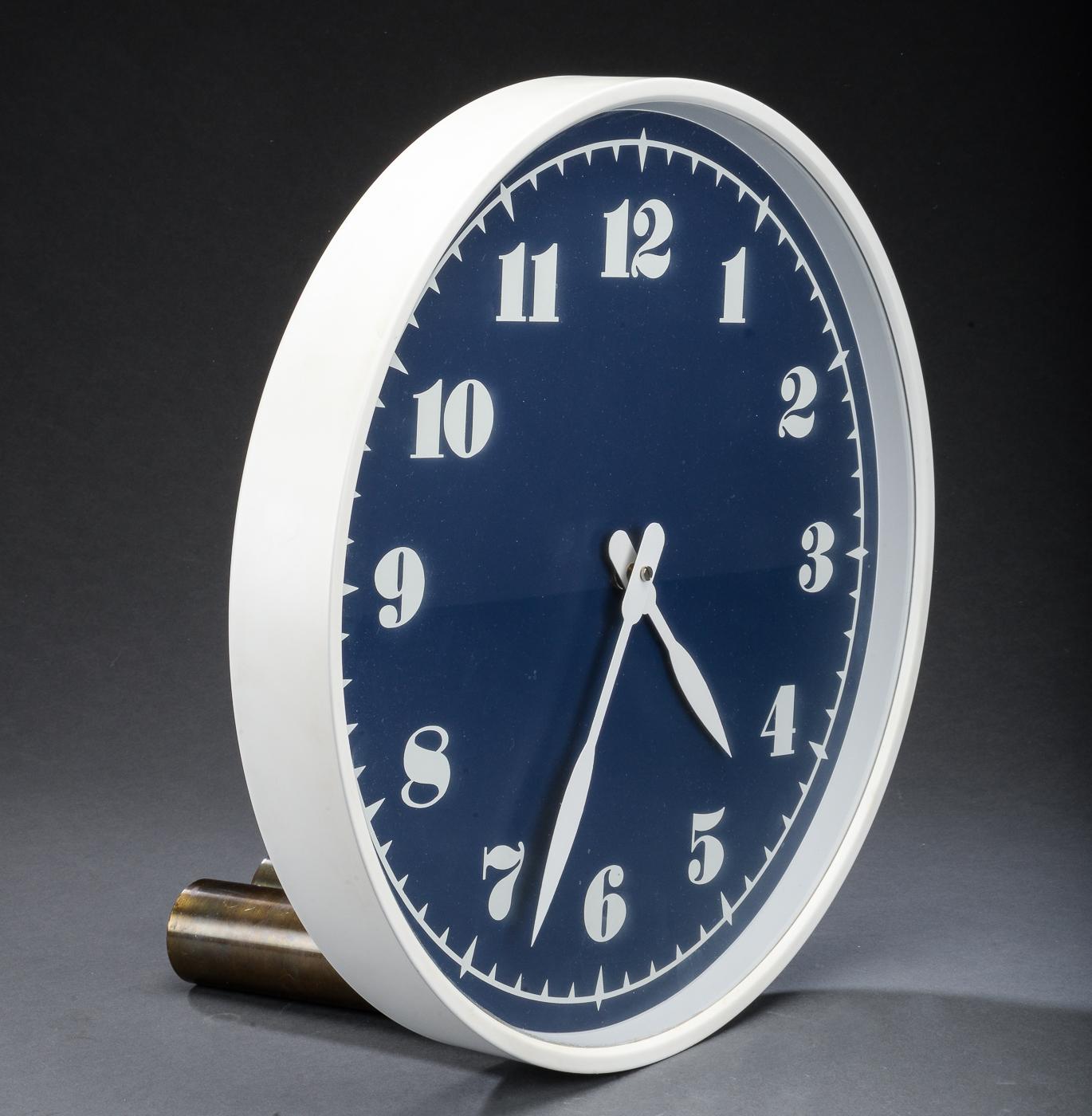 Industrial wall clock made in 1979 by Louis Poulsen Company in Denmark. Frame made of painted aluminum. The clock face blue painted with white digits and pointers. Formerly a slave clock, it is now fitted with a modern quartz movement with an