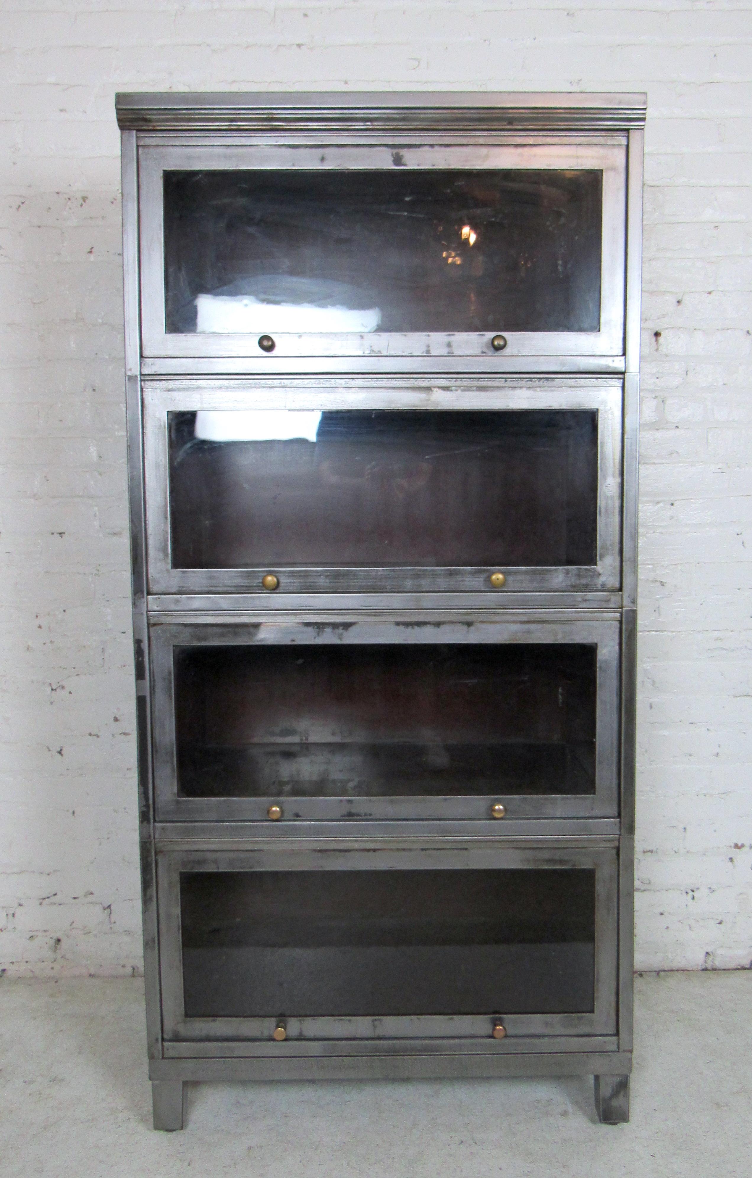 Vintage industrial metal four-stack bookcase features a glass front, round metal knobs and a sturdy metal detachable base. Recessing glass fronts that allow for dust free storage at home or in the office.


Please confirm item location (NY or NJ).