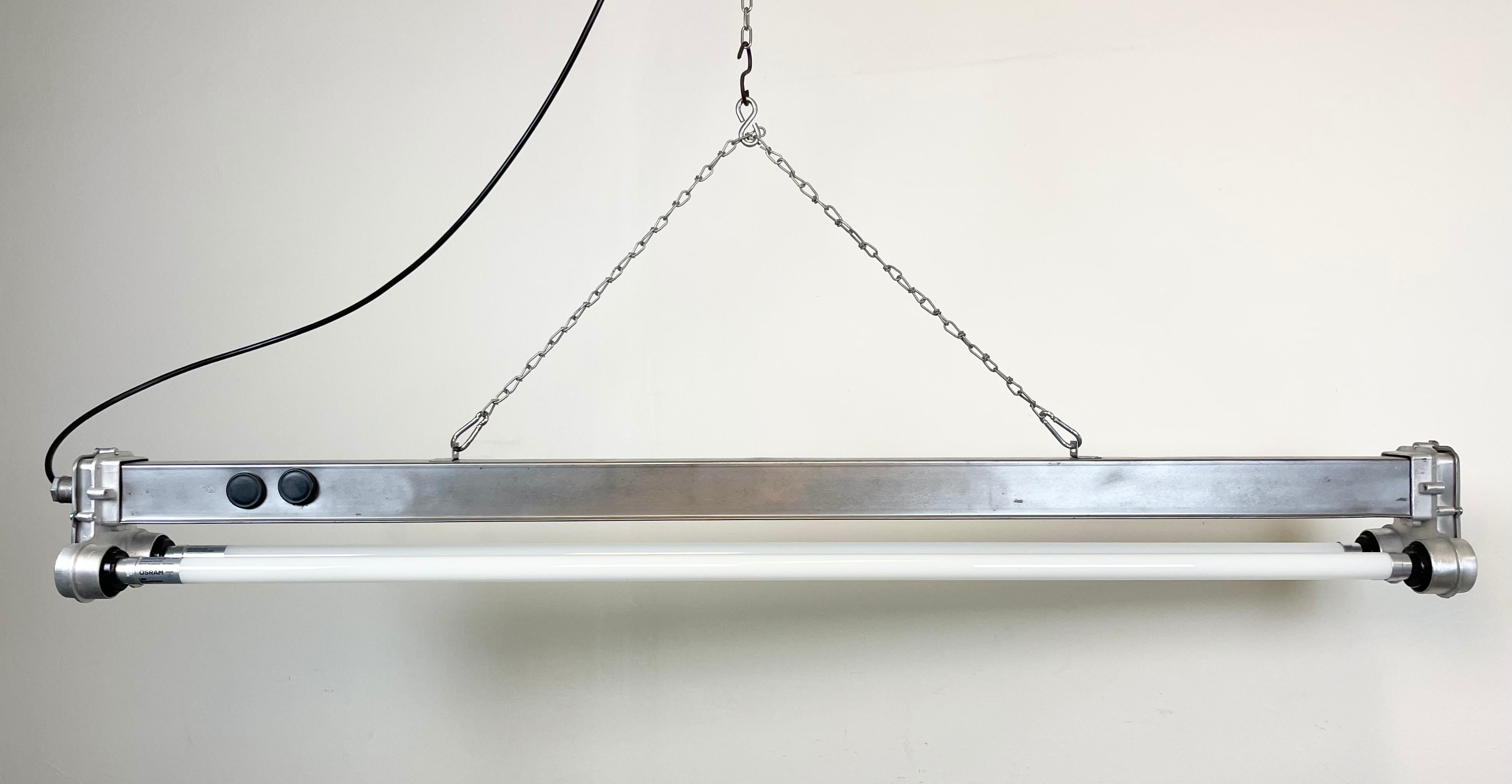 This industrial metal fluorescent light was made by Polam Wilkasy during the 1970s in Poland. These fixtures were used in laboratories and chemical and industrial plants. The light is converted into two led T8, 120 cm fluorescent tubes. The weight