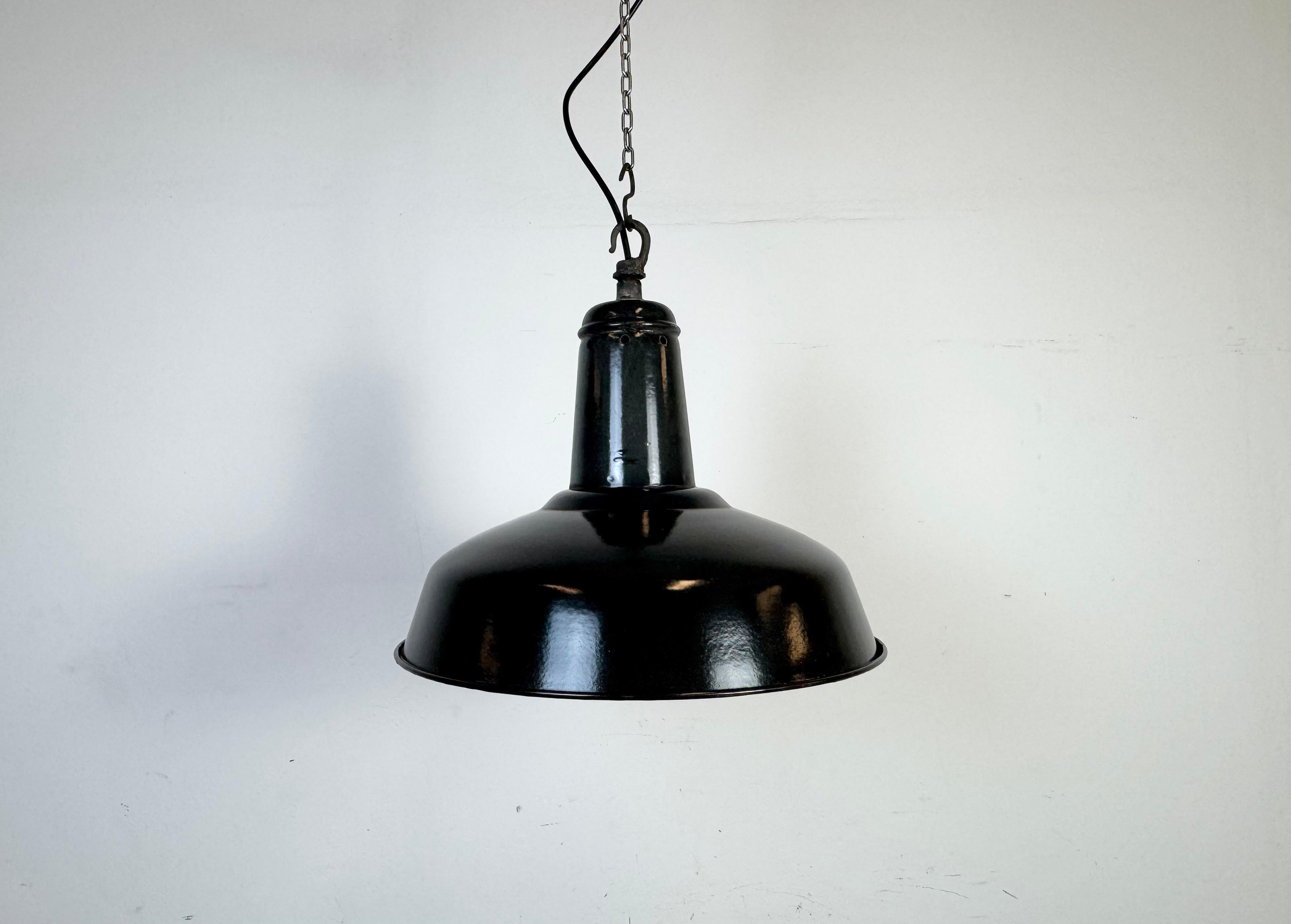 Industrial dark grey ( black ) enamel pendant light made in France during the 1960s. White enamel inside the shade. Metal top. The socket requires standard E27/E26 light bulbs. New wire. The weight of the lamp is 1, 4 kg.The diameter of the shade is