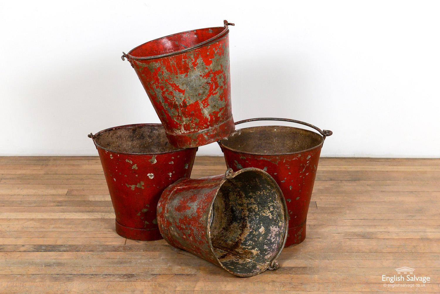 Salvaged red galvanised fire buckets. Approximate size of each below, height doesn't include the 20cm high handle. Chips, knocks and scratches as expected with past use.