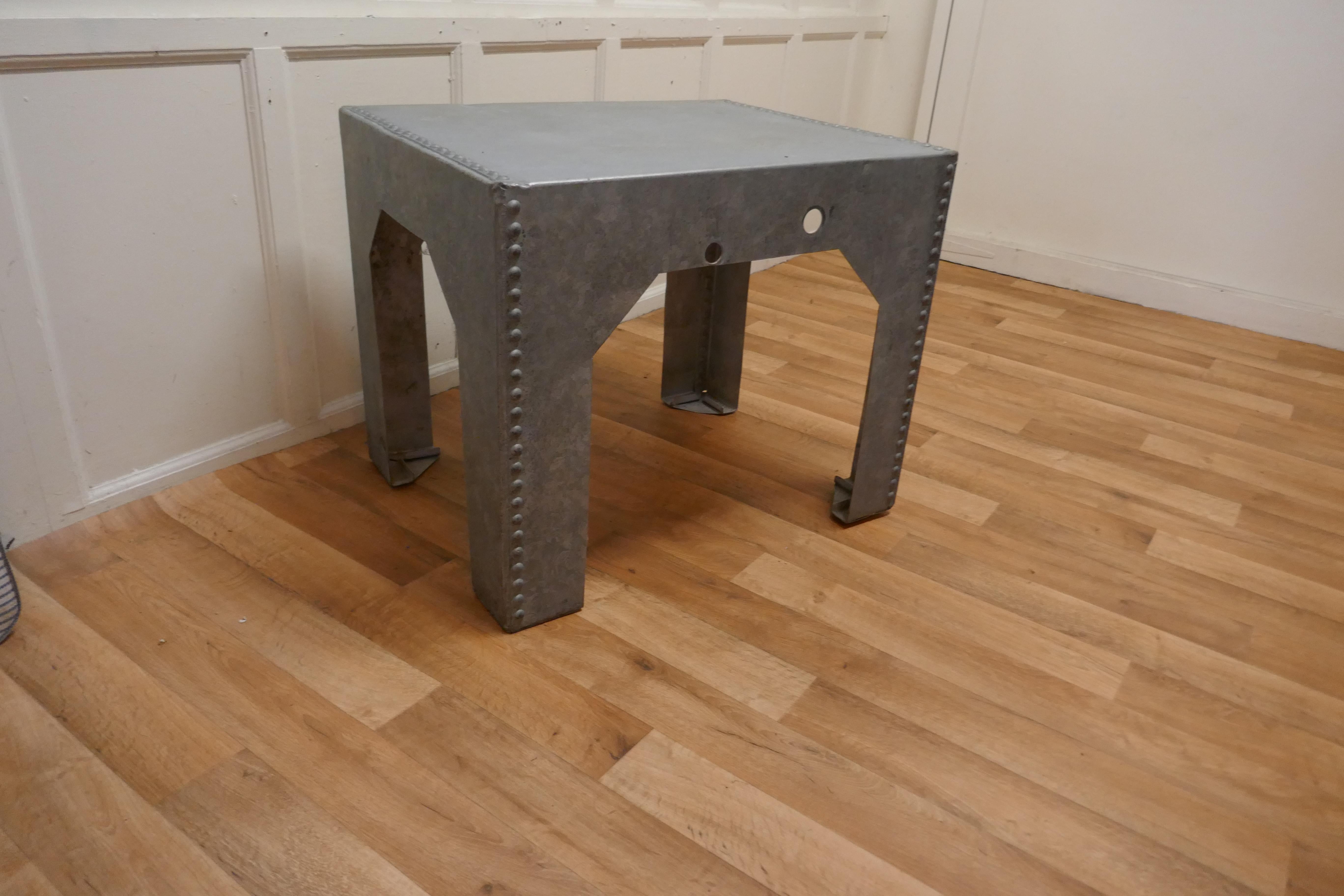 Industrial galvanised water tank made into a coffee table.

This quirky industrial table was originally made as a roof water tank, but it has never been used as such, it has been professionally converted into a convenient, unique coffee