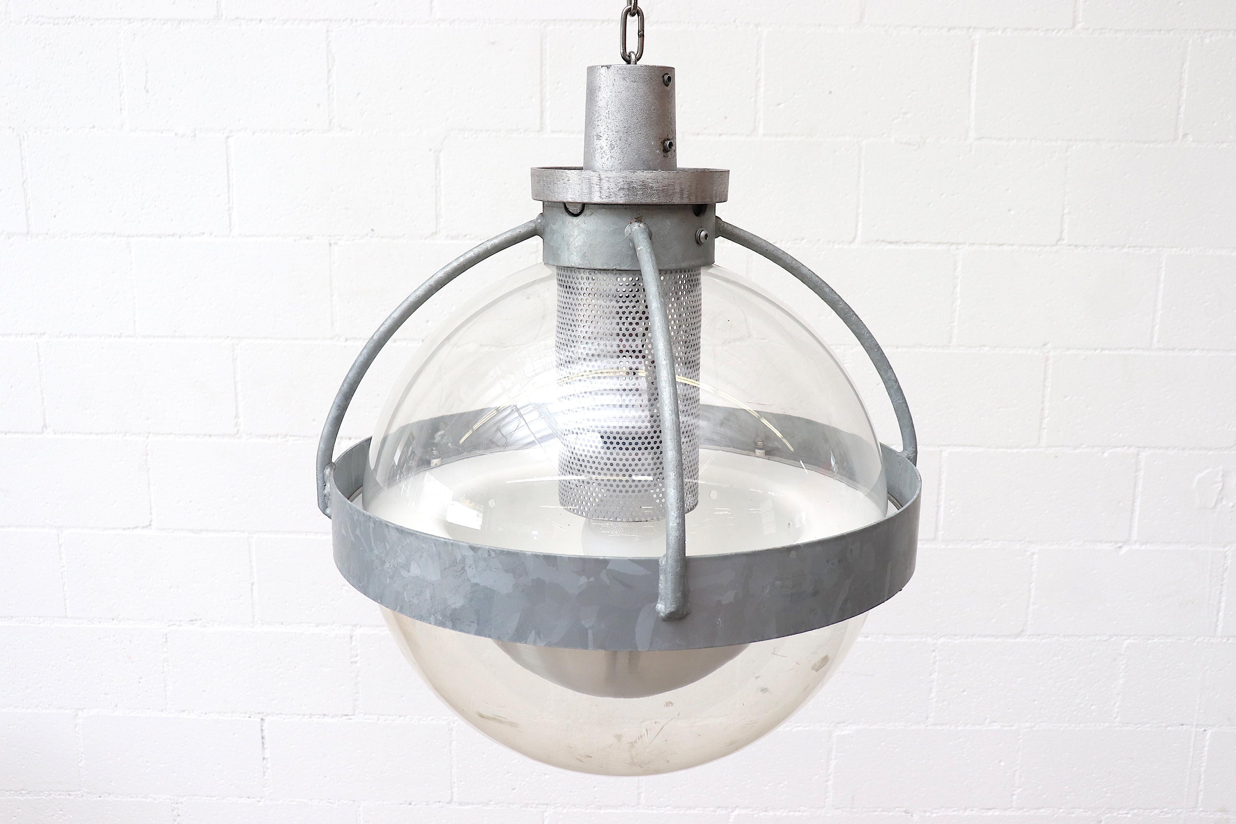 Midcentury industrial galvanized metal and acrylic globe ceiling lights. In original condition with visible wear and scratching. Heavy!! Individually priced.
