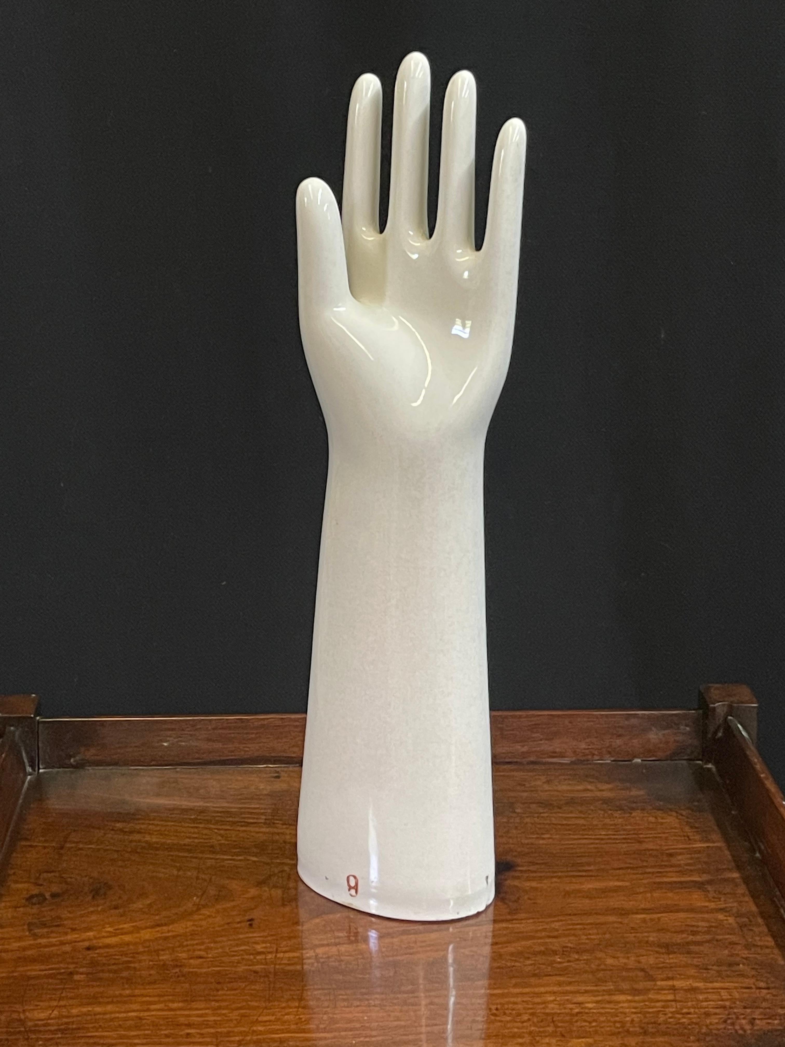 Large midcentury left hand industrial glove mold made of white porcelain and stamped in red ‘PATENT 2261583 February 3, 1944.’

The mold measures 17.5