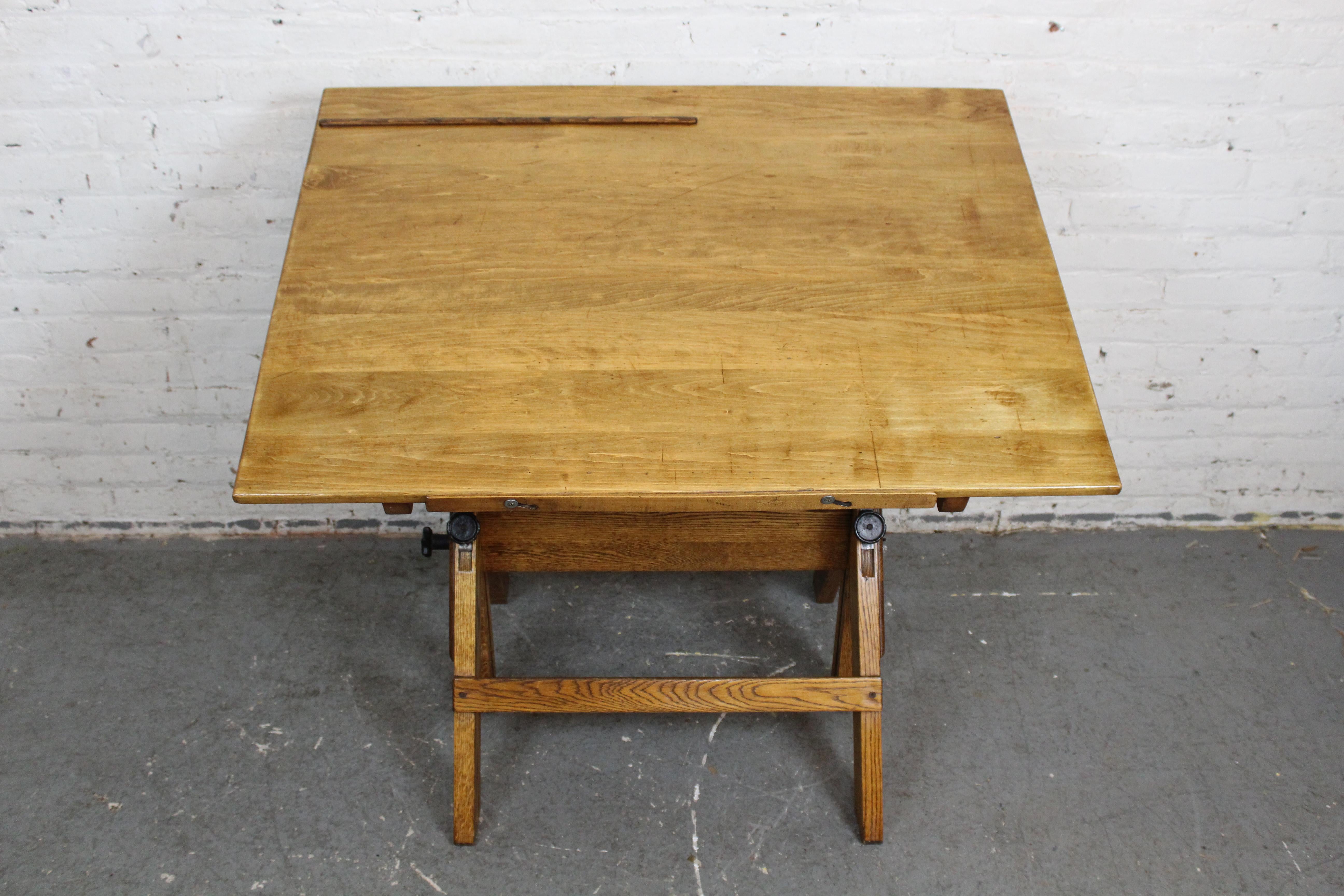 From drawing blueprints to serving brunch, experience the versatile magic of industrial furniture with this stunning drafting table made by Hamilton Manufacturing Co. of Two Rivers, Wisconsin! This beautiful early-20th century piece has been built