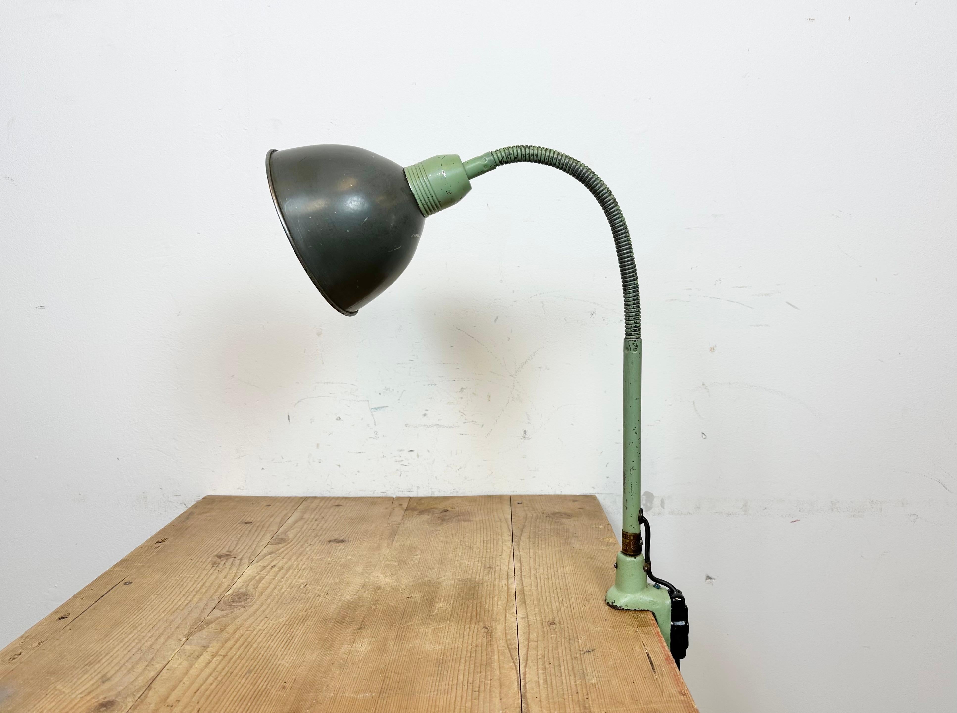 Industrial flexible gooseneck table lamp with clamp base made by Instala Decín in former Czechoslovakia during the 1960s. Good vintage condition. The socket requires standard E 27 / E26 light bulbs. The lampshade diameter is 17 cm.
The weight of the