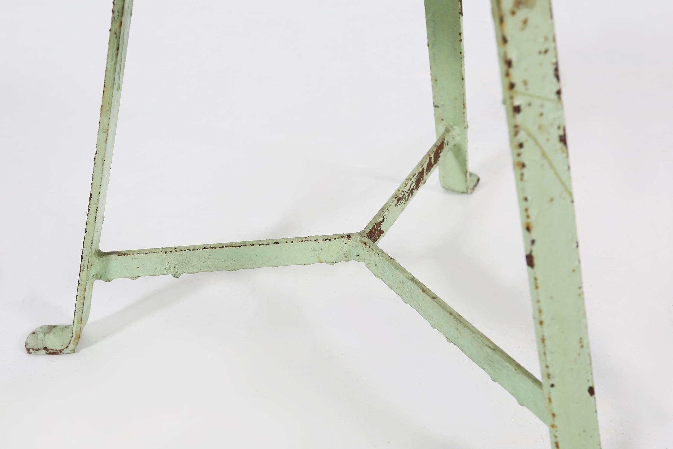 Painted Industrial green painted stool with steel base and wooden top, France 1930s For Sale