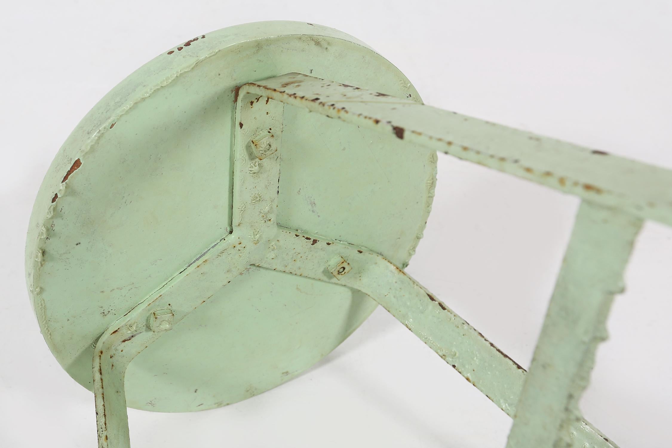 Industrial green painted stool with steel base and wooden top, France 1930s For Sale 1