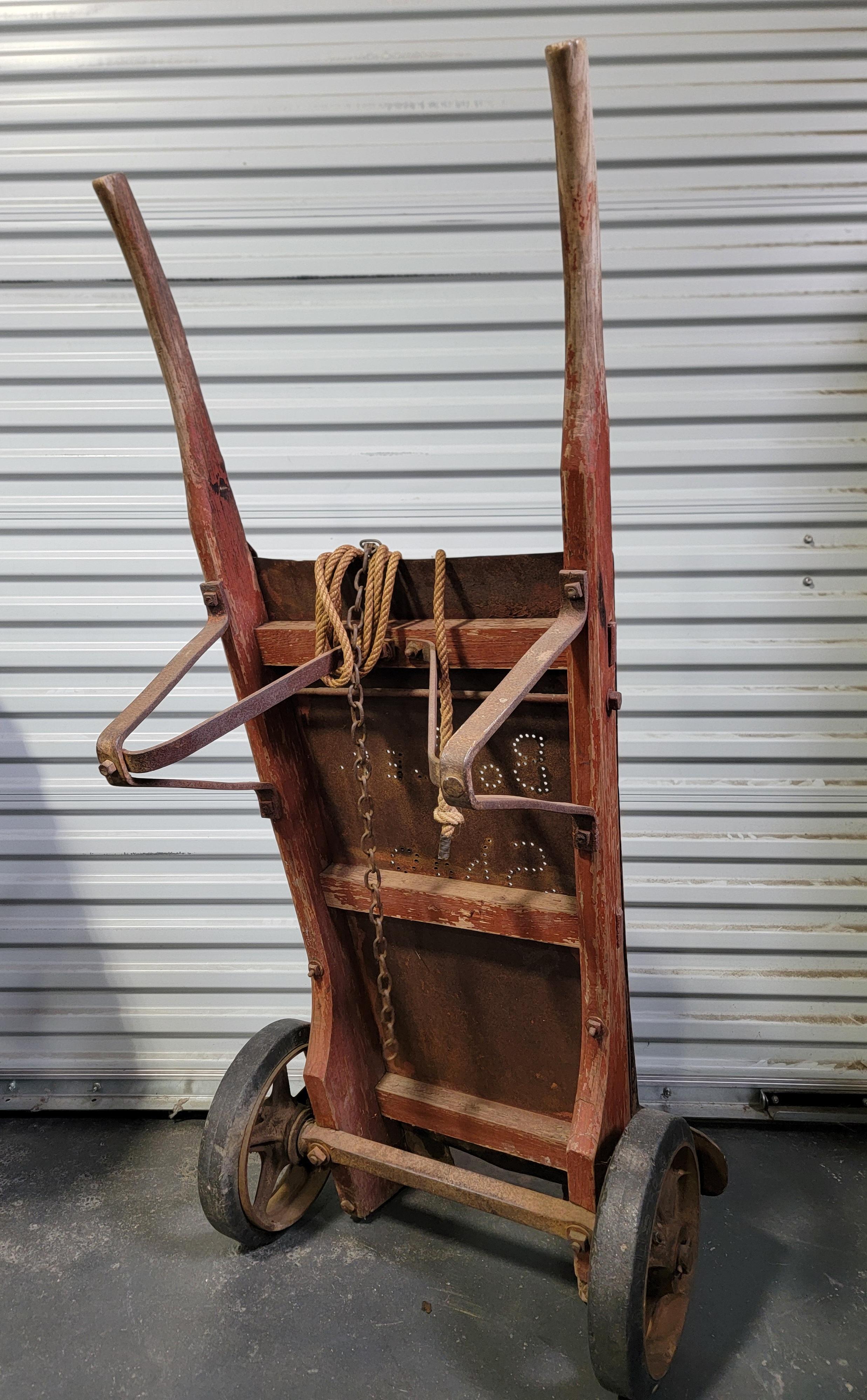 Industrial workshop hand truck with original red painted oak. Punched into back plate 