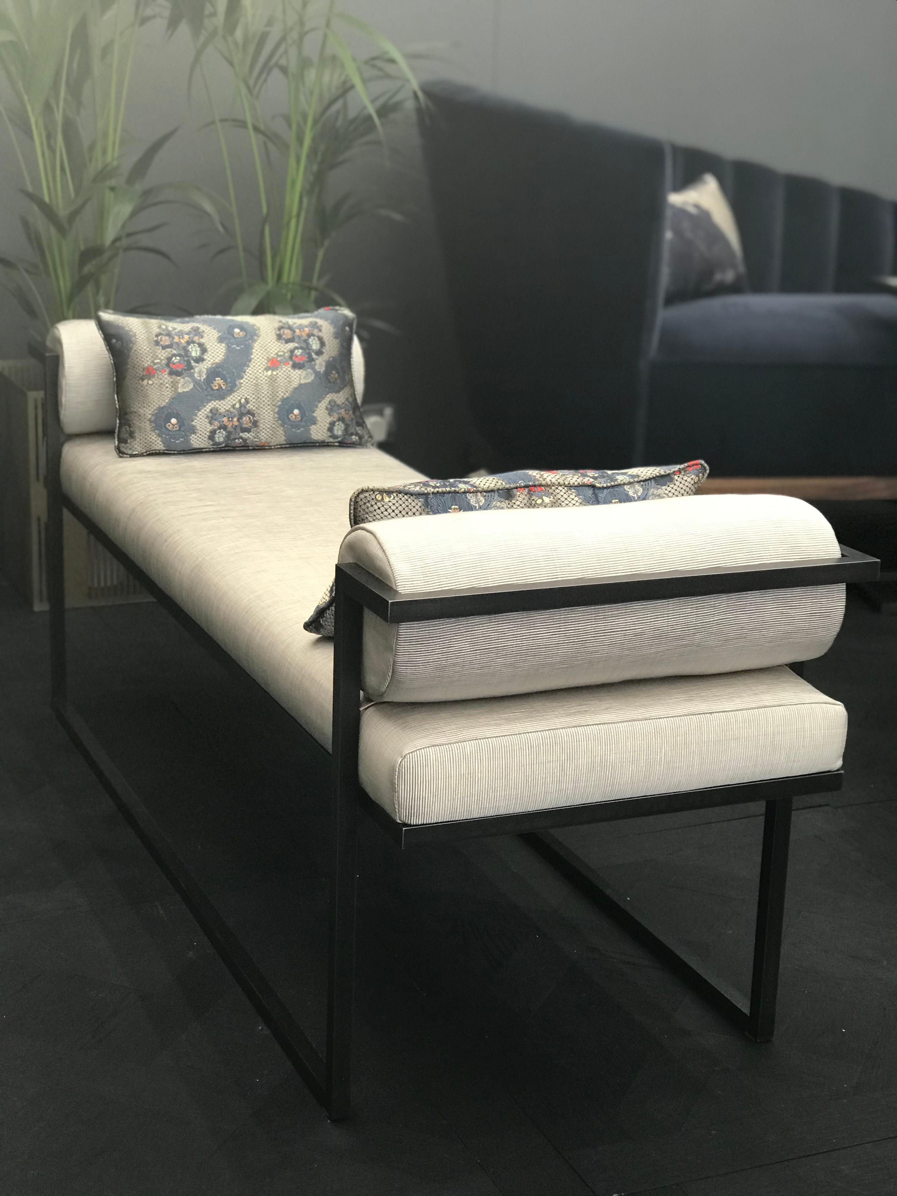 Named after the Greek god of sexual attraction, the Eros bench will visually seduce with its architectural lines and demanding presence. Made from blackened steel and upholstered in one of Casa Botelho’s luxe fabrics, the Eros bench is an ideal