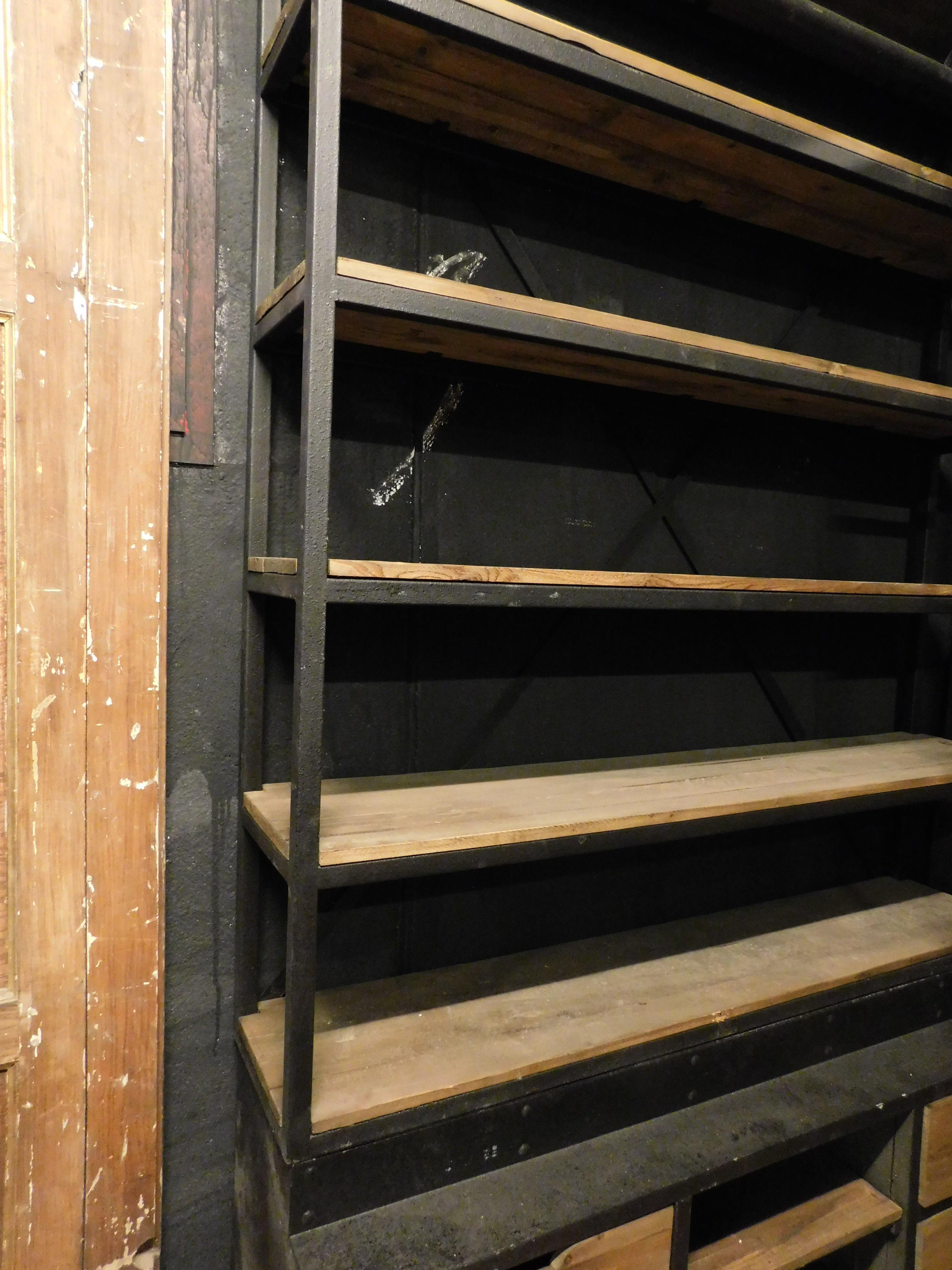 Late 20th Century Industrial iron bookcase with wooden shelves and drawers complete with ladder For Sale