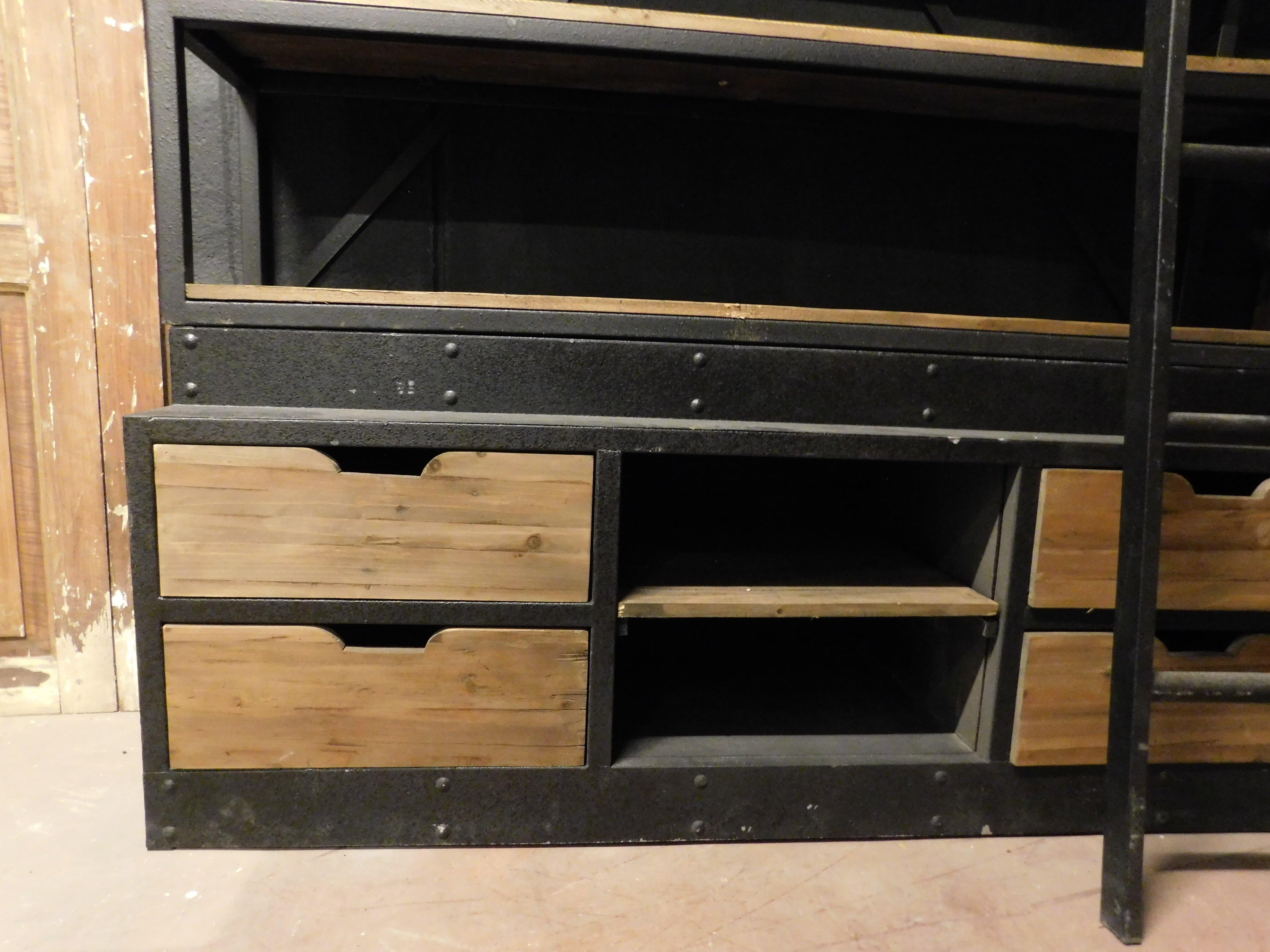 Iron Industrial iron bookcase with wooden shelves and drawers complete with ladder For Sale