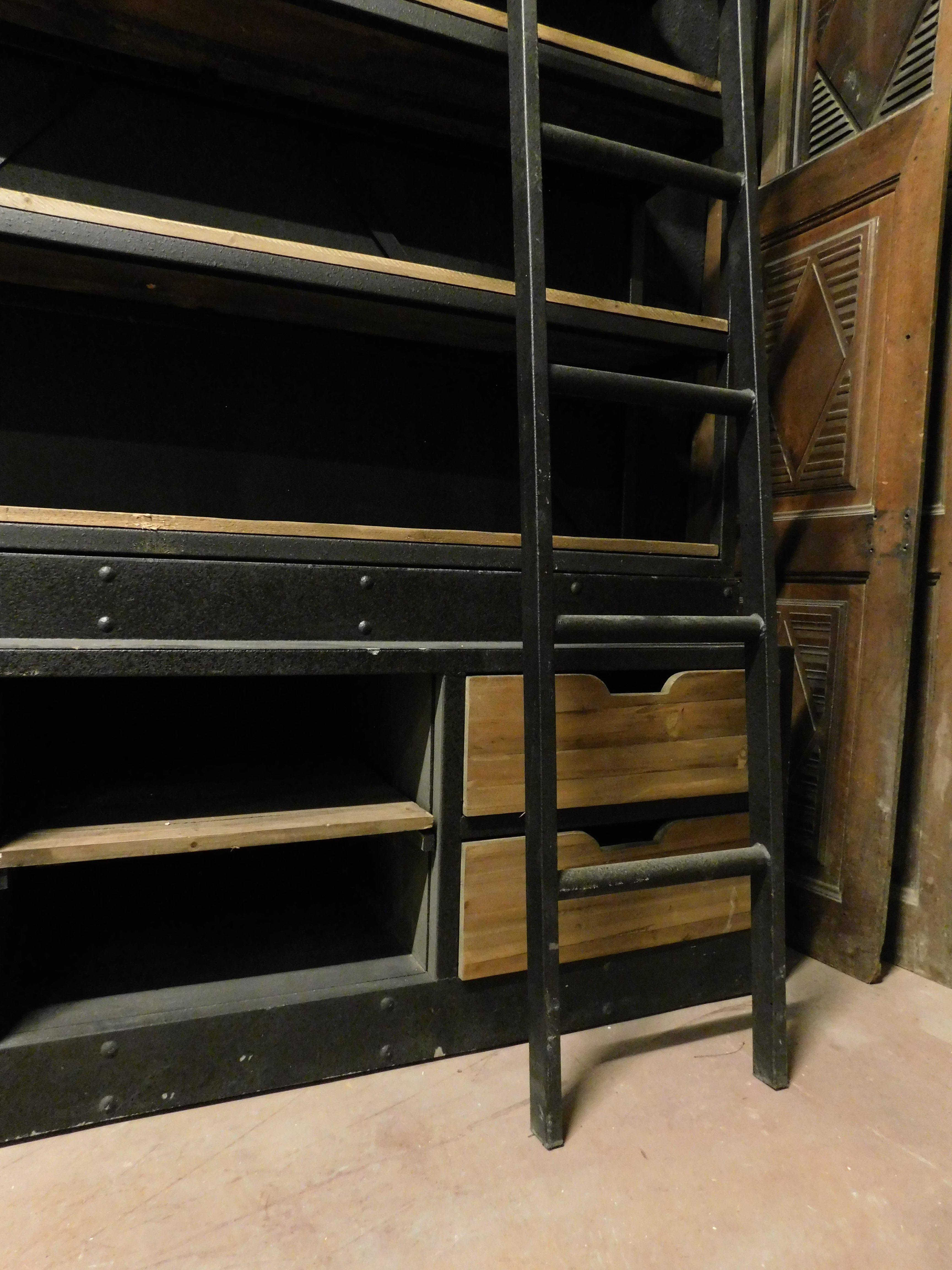 Industrial iron bookcase with wooden shelves and drawers complete with ladder For Sale 1