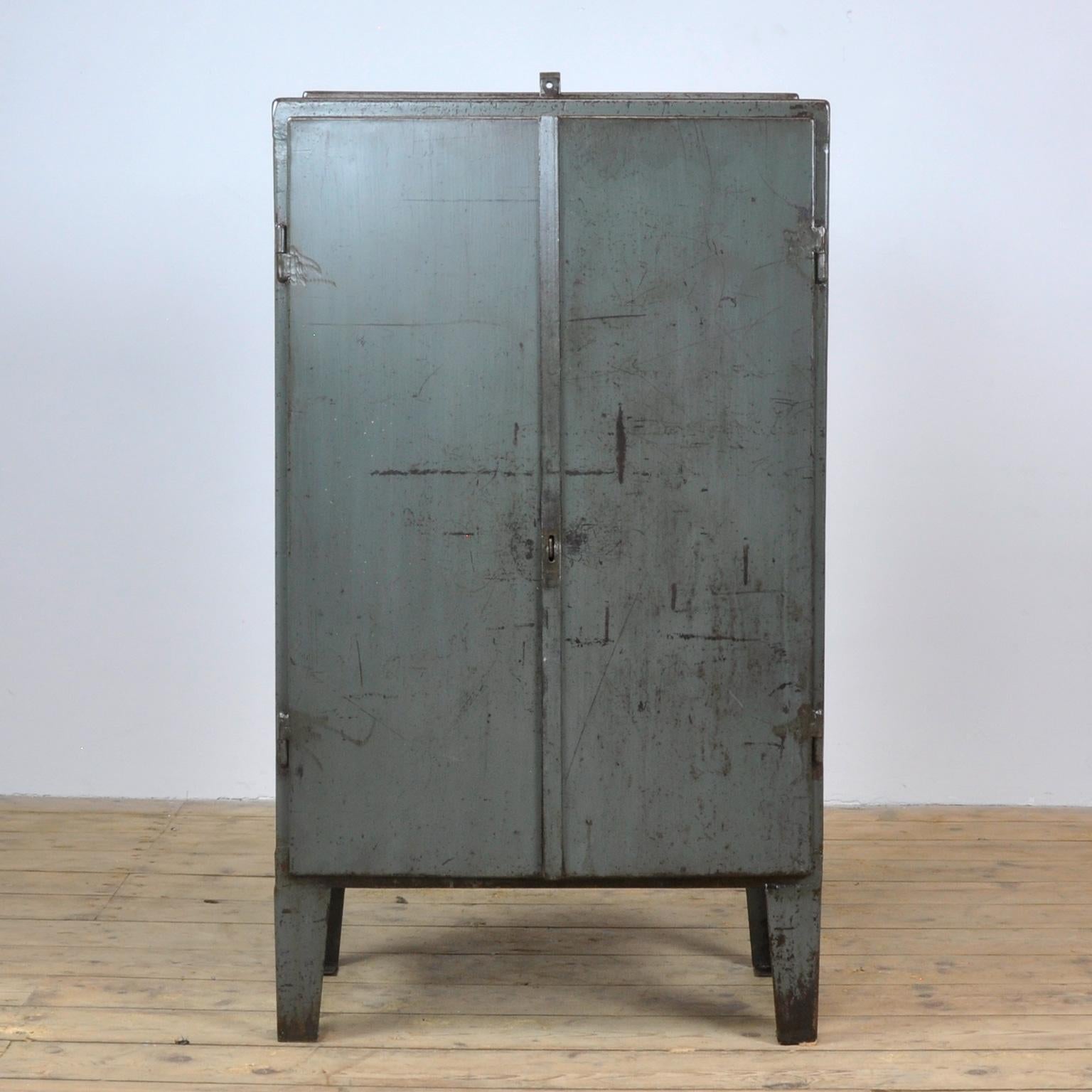 Iron industrial sideboard in good condition. Made of metal. With on top of a valve. Two shelves and two drawers on the inside. Treated for rust and finished with a transparent varnish.